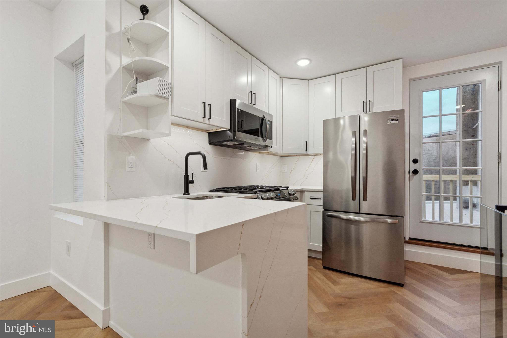 Welcome to your dream home at 1438 Tasker Street in Philly's vibrant Newbold neighborhood! Just a couple minutes' walk from East Passyunk's buzzing bars, restaurants, and shops. This 1 bed 1 bath gem boasts a complete gut renovation with high-end finishes that scream luxury. Think sleek countertops, modern fixtures, and every detail crafted for comfort and style. The top unit is luxury at its finest