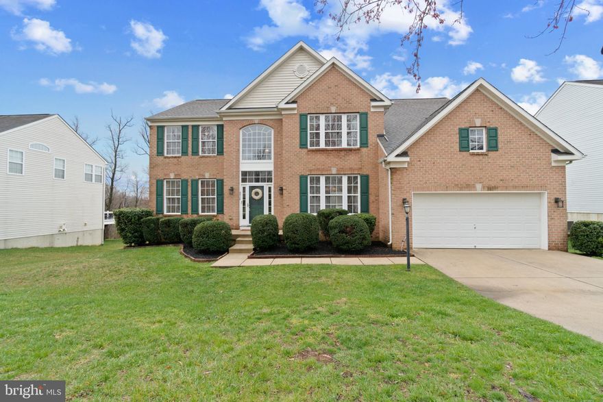 Stately brick front colonial set on a .32 acre homesite backing to trees in the sought-after community of
Glynchester Farm is turnkey ready with spacious rooms, high ceilings, beautiful hardwoods, profile crown
moldings, and a classic design. Pristine and well accented, this home features a 2-story foyer with a dual upper level overlook that provides direct access to a formal living room accentuated by crown molding with French doors opening to a private study, and a formal dining room with chair rail trim and crown molding, followed by a butler's pantry for ease in serving. Bright and vibrant, the family room is finished with an 18’ vaulted ceiling with a cooling fan, a gas fireplace flanked by geometric windows, a second floor overlook, and just steps away from the kitchen. At home chef’s kitchen displays granite counters, 42" raised frame wood cabinetry, stainless steel appliances, a center island with breakfast bar, a planning desk, and a casual dining space overlooking a sunfilled morning room showing a leaf design fan and glass sliders stopping to a low maintenance tiered deck. Upstairs you find 4 bedrooms which includes a spacious owner’s suite presenting a lighted ceiling fan for added comfort, 2 walk-in closets, and a private garden bath with, a dual vanity, a glass enclosed shower, and a corner platform soaking tub. Great for storage, the unfinished walkout lower level gives you the opportunity to create the room of your dreams, exactly the way you like with all the personalized touches. Desired Ellicott City location near state parklands, shopping, dining, entertainment, recreation, and commuter routes.