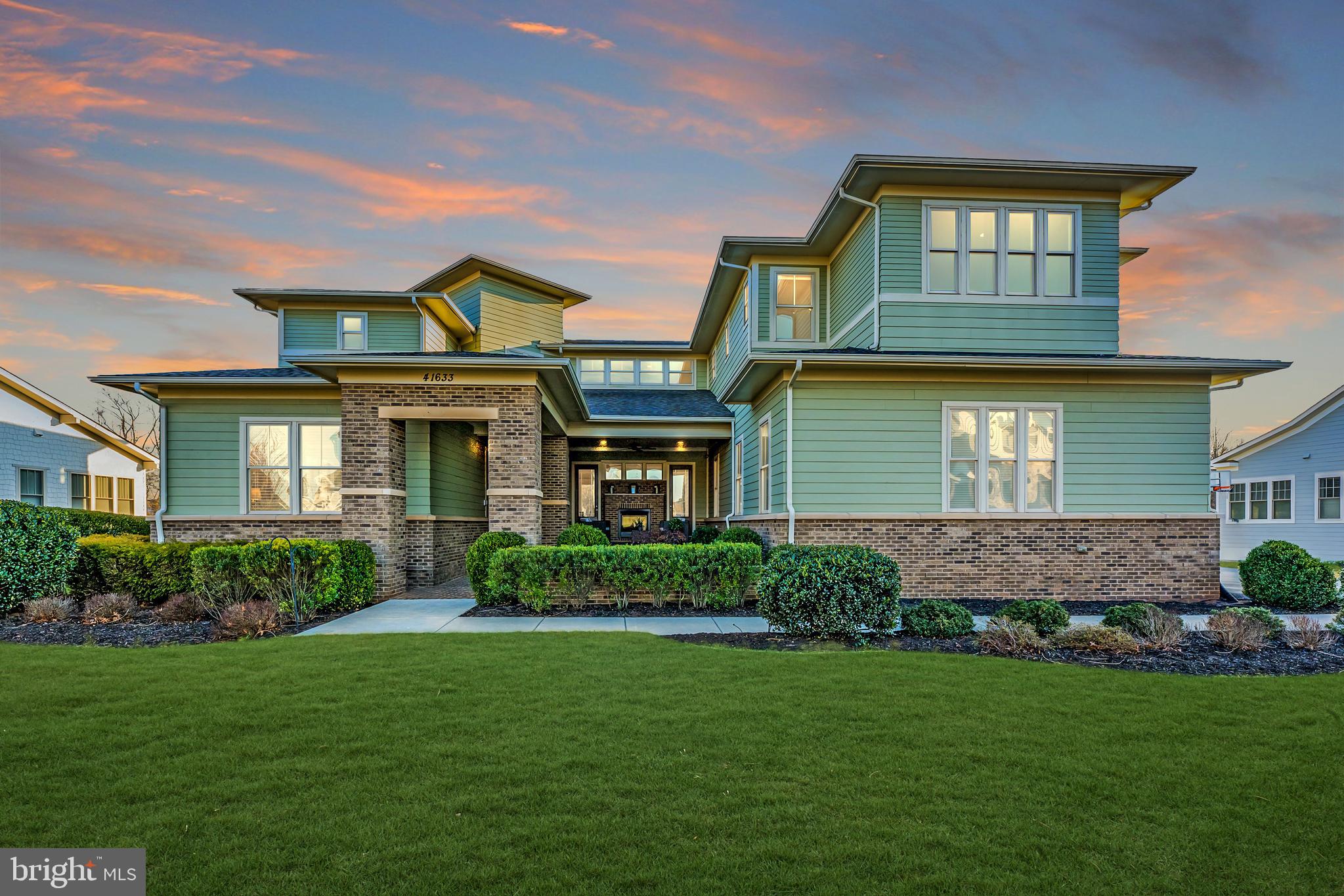 Welcome to 41633 White Yarrow Court, a stunning retreat nestled within Willowsford, Loudoun County’s acclaimed planned community. Willowsford weaves together four distinct villages—The Grant, The Grange, The Grove, and The Greens—each inspired by its natural surroundings and united by a vibrant, connected lifestyle. This exceptional property resides in The Grange, one of Ashburn’s two villages, offering effortless access to top-tier amenities and a prime location just moments from dining, shopping, major roadways, Metro’s Silver Line Stations, and Washington’s Dulles International Airport. <BR><BR>
Meticulously cared for by its original owner, this Kirkland model, crafted by Arcadia Homes, rests on a serene .29-acre lot along a quiet no-through street, bordered by protected conservancy land. Enhanced by a rare six-foot “bump-out” across all three levels, this home spans over 6,500 square feet of beautifully finished space, featuring seven bedrooms and 4.5 baths. Bathed in natural light, the three-level design includes 10-foot ceilings on the main floor, where gleaming engineered hardwood floors, refined moldings, and designer lighting set an elegant tone. The heart of the home is its seamlessly integrated kitchen and family room, anchored by a striking multi-sided, see-through gas fireplace. Step outside to a newer Trex deck, perfect for soaking in tranquil conservancy views. The main level also offers a dining room, a living room, a bedroom, a full bath, and a thoughtfully designed mudroom with custom shelving. <BR><BR>
Ascend the wide, split-level staircase to the upper level, where the luxurious primary suite awaits. This private sanctuary features a spa-inspired bath, a spacious walk-in closet, a separate sitting area, and a stunning terrace with amazing views. A roomy landing just outside acts as an inviting lounge, while two front-facing bedrooms connect to a delightful playroom. A fourth bedroom, a full bath, and a convenient laundry room complete this level. <BR><BR>
The lower level is a custom-crafted gem, offering nearly 10-foot ceilings, engineered hardwood floors, and plush carpeting in the ensuite bedroom. With over 2,000 square feet of versatile living space, it’s an ideal family retreat or multigenerational suite. Highlights include a large recreation room with a gas fireplace, a well-appointed kitchenette (complete with dishwasher, full-sized refrigerator, sink, and ample cabinetry), a dining/gaming area, a half bath, bedroom suite with full bath and custom designed walk-in closet, a separate laundry room, and a private office or potential seventh bedroom. Two sets of double doors with retractable screens open to an expansive patio, blending indoor and outdoor living with ease. <BR><BR>
Beyond its interior, this home shines with four exceptional outdoor spaces: a gracious front porch with a gas fireplace, the perfect-sized Trex deck off the main level, the upper-level terrace off the primary suite, and a backyard patio with a fire pit—perfect for gatherings or quiet evenings. This home demands to be experienced in person. Join us at one of our upcoming open houses to see it for yourself! <BR><BR>