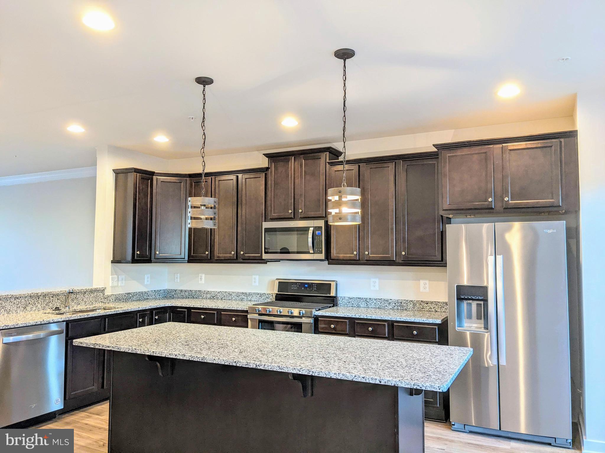 townhome built by Dan Ryan Homes at The Villages of Urbana! This spacious 3 level townhome offers , open floor plan Entry level Bed room Or rec room with full bath total of 4 Bedrooms 3.5 Baths a large deck off the kitchen. and rear load two car garage. Wood stair case and Main level LVP kitchen with large island and pendent lights, opens to Dining room and living room, Upper level Owner’s suite with large walk-in closet, dual vanity, and shower. Two other good sized bed rooms . bedroom level Laundry walking distance to Sugarloaf Elementary, highly ranked Urbana Middle School* and Maryland's only National Blue-Ribbon High School, Urbana High School Close to shopping 270. Walking distance to Urbana Community Park, Urbana district park, easy access to Award winning planned community with abundant community amenities: walking/biking trails, shops, restaurants, community pools (including one recreational water park), community centers, basketball courts, tennis courts, state of the art library, seasonal farmer's market, and multiple playgrounds/parks. Available immediately.