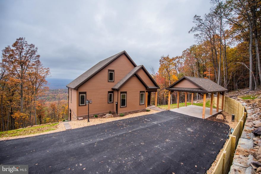 THIS CUSTOM BUILT HOME IS LIKE NO OTHER.  It has a western year round of a State Forest with complete privacy. This home has Hardwood floors throughout, Ceramic Tile Flooring in Bathrooms, Upgraded Energy Efficient Appliances, Stone Gas Fireplace with Mantel, Wood and Granite Counter Tops, Wood Counter Tops in the laundry room, Open Floor Plan, Master Bedroom has a extra large Ceramic Tile shower, Walk-in Closets, Large Trex Decking overlooking spectacular sunsets and a magnificent view. Nicely landscaped, with a extra large carport which will house 1 vehicles. Walk out unfinished basement. This home comes with a  builder warranty.  Couple weeks from completion.  This is a must see.