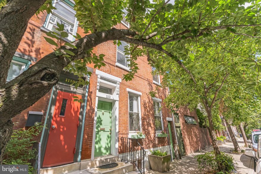 Victorian Style rowhouse in Northern Liberties 2310 square feet. Entrance foyer. Living Room with marble mantle, built ins, ceiling fan, high ceilings and oak floors with wood inlay.   Powder Room, Separate Dining Room with china cupboard, leaded glass in the door, rear stair connects to the second floor.  Refreshed Galley Kitchen with new vinyl floor, new gas stove,  new sink, faucet, dishwasher, garbage disposal and several new cabinets to create an efficient space.  Rear Patio.  2nd floor rear: Bedroom and office suite, carpeted  and  Bath with new tub and new tile around the tub.  2nd floor front: Main Bedroom with pine floors.  3rd floor front: over sized Bath with new tub and new tile around the tub.  Front carpeted Bedroom. Full unfinished Basement with washer/dryer in as is condition, freezer and mechanicals.
