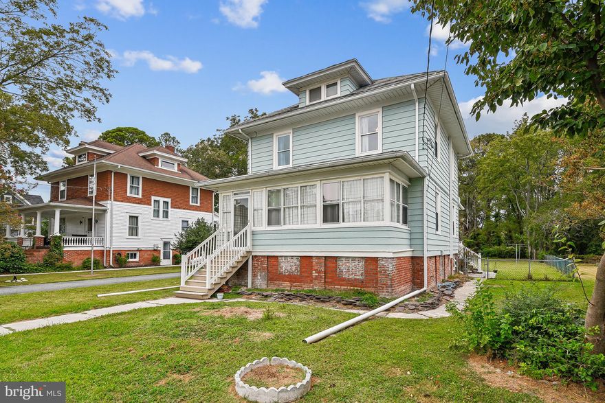 Welcome to a true classic in the heart of Crisfield, MD—104 years young and filled with charm! This timeless home has been thoughtfully updated to give you the best of both worlds: historic character and modern comfort. Inside, you’ll find hardwood floors throughout, a spacious living and dining room, a well-appointed kitchen, and 3 bedrooms with 2 full baths that provide plenty of space for family or guests.
The enclosed front porch/sunroom is heated and cooled so you can enjoy it year-round, while the large back deck is perfect for entertaining or relaxing outdoors. A sizable shed/workshop with 80AMPS Electric Service adds extra space for storage or projects. In the last 7 years, the Seller has invested in all the big-ticket updates for peace of mind—new HVAC system, updated electric, new insulation, new paint, new appliances, a sump pump in the crawlspace, a tankless water heater, updated bathrooms, and even a water softener system, just to name a few things! Plus, enjoy the convenience of city services with no worries about well or septic. This home is full of heart, character, and thoughtful upgrades—and waiting for you to make new memories! And when you’re ready to explore, enjoy all that Crisfield, Maryland has to offer—from world-class crabbing and fishing, to fresh seafood dining, boating, and breathtaking sunsets over the Chesapeake Bay.