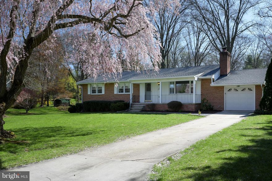 House you have been waiting for! - Situated on quiet street, updated home offers: gorgeous hardwood flooring; a new, remodeled open kitchen with custom cabinetry, granite tops, stainless appliances; efficient replacement windows; an enormous finished lower level with 4th bedroom/full bath + great play & entertainment space + unfinished work & storage space too! Quaint front porch & new roof 2014