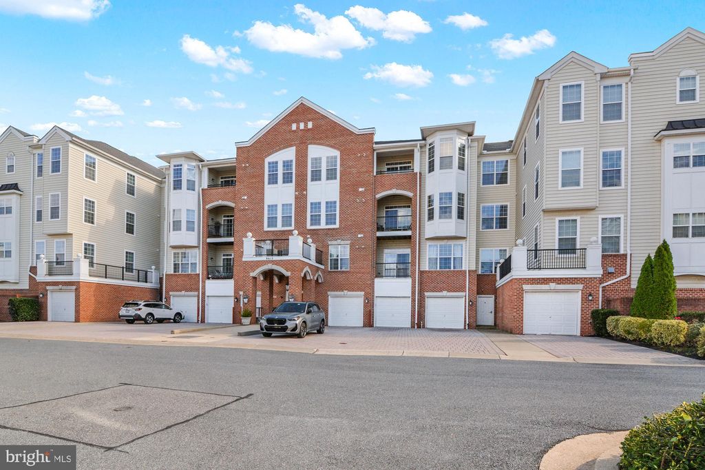 Photo of 8615 Wandering Fox Trail #406, ODENTON, MD 21113 (MLS # MDAA2129516)