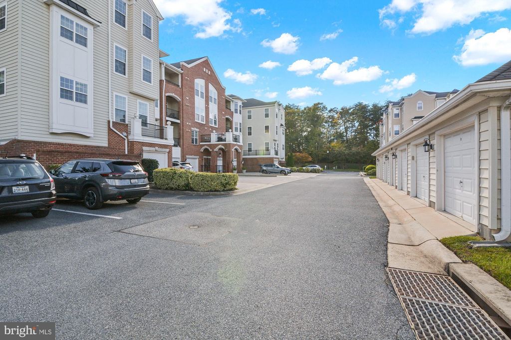 Photo of 8615 Wandering Fox Trail #406, ODENTON, MD 21113 (MLS # MDAA2129516)