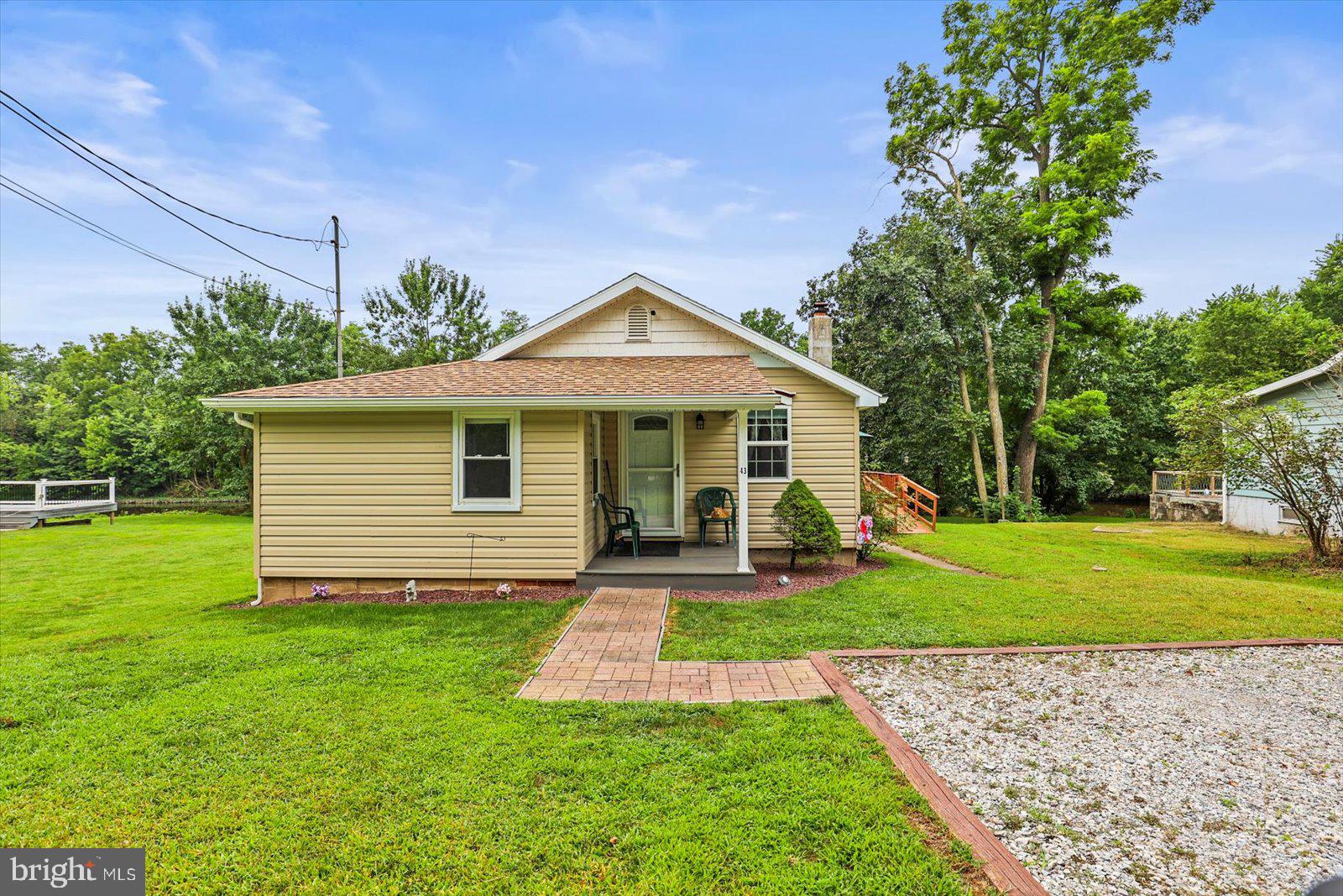 Charming Move-In Ready Rancher Along the Conewago Creek. Welcome to this beautifully updated rancher nestled along the scenic Conewago Creek. The primary bedroom provides private access to a second bedroom, making it perfect for a nursery, home office, or guest room. Additionally, there's potential for a third bedroom or flex space just off the laundry room—see attached floor plan for layout options. Perfectly move-in ready, this home offers low-maintenance living with easy-clean luxury vinyl tile (LVT) flooring throughout and a thoughtful layout designed for convenience and comfort. Step into the bright and inviting living space that flows into the updated kitchen, featuring modern finishes and ample cabinetry. The refreshed bathroom offers stylish fixtures, while the first-floor laundry adds everyday practicality. Enjoy the peaceful surroundings from your own backyard with views of the creek, perfect for relaxing or entertaining. Whether you're a first-time homebuyer, downsizing, or looking for a weekend retreat, this home checks all the boxes. Don’t miss this rare opportunity to own a creekside gem—schedule your tour today!