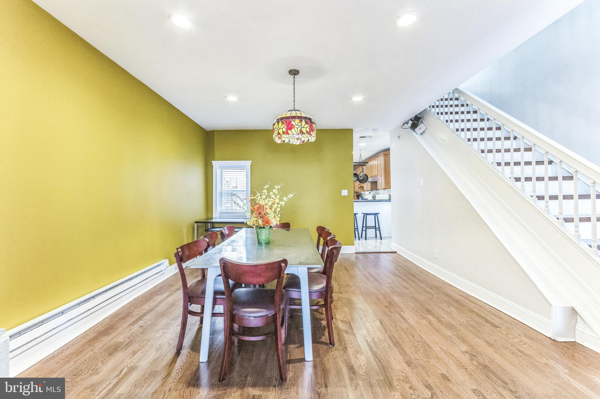 Welcome to an extraordinary home brimming with charm and character, ideally located near Fishtown with easy access to I-95. Enjoy a short stroll to local favorites including Memphis Taproom, Philadelphia Brewing Company, Martha, Atlantis, Greensgrow, Wawa, grocery stores, and more.
Step through the foyer into a spacious living room featuring 10-foot ceilings, original moldings, a stunning stone mantel, and gleaming hardwood floors. The oversized dining room seamlessly flows into a chef-inspired kitchen, complete with a breakfast bar, poured concrete countertops, subway tile backsplash, stainless steel appliances, and ample cabinetry—plus a walk-in pantry offering exceptional storage. A convenient powder room is located at the rear of the home.
Step outside from the kitchen into your private backyard oasis, perfect for entertaining. The space includes green space, a beautiful patio with an exposed brick wall, and solar-powered string lights for added ambiance.
The basement offers generous storage space. On the second floor, you’ll find a dedicated office nook, a full bathroom with laundry, and two additional bedrooms with another full bath. The third floor offers a flexible workout area with a walk-in closet, a Jack-and-Jill bathroom, and two more bedrooms.
Buyers are responsible for verifying square footage and taxes. Adjacent lot at 2200 E. Cumberland may be purchased together—price negotiable!
