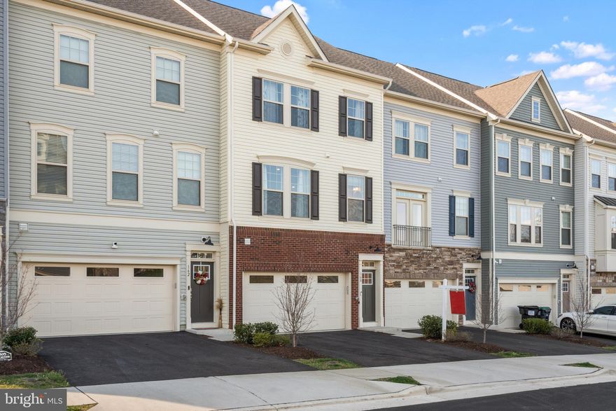 RARE opportunity to own this nearly new luxury townhome with 4 bedrooms, 3.5 baths, 2 car garage and 4 ft extension on all levels! Elegant exterior with brick water table and 6 over 1 windows allows for lots of natural light.  Entry way with Oak stairs from first to second floor with open railings.  Open floor plan with gourmet kitchen that include huge quartz topped island, upgraded cabinetry, stainless steel appliances, backsplash and custom lighting.  Main level features luxury vinyl plank flooring, tons of recessed lighting and opens to flat backyard with patio and fence perfect for enjoying the warm weather to come! Owner’s suite is located on the upper level with ensuite bathroom that features double vanity and upgraded tile.Two additional bedrooms are located upstairs that share a hall bathroom with upgraded tile.  Laundry room is conveniently located on bedroom level.  The lower level features the fourth bedroom with barn door and full bathroom.  Convenient location minutes to shopping and dining options, two miles to I-95 and 8 miles to VRE.