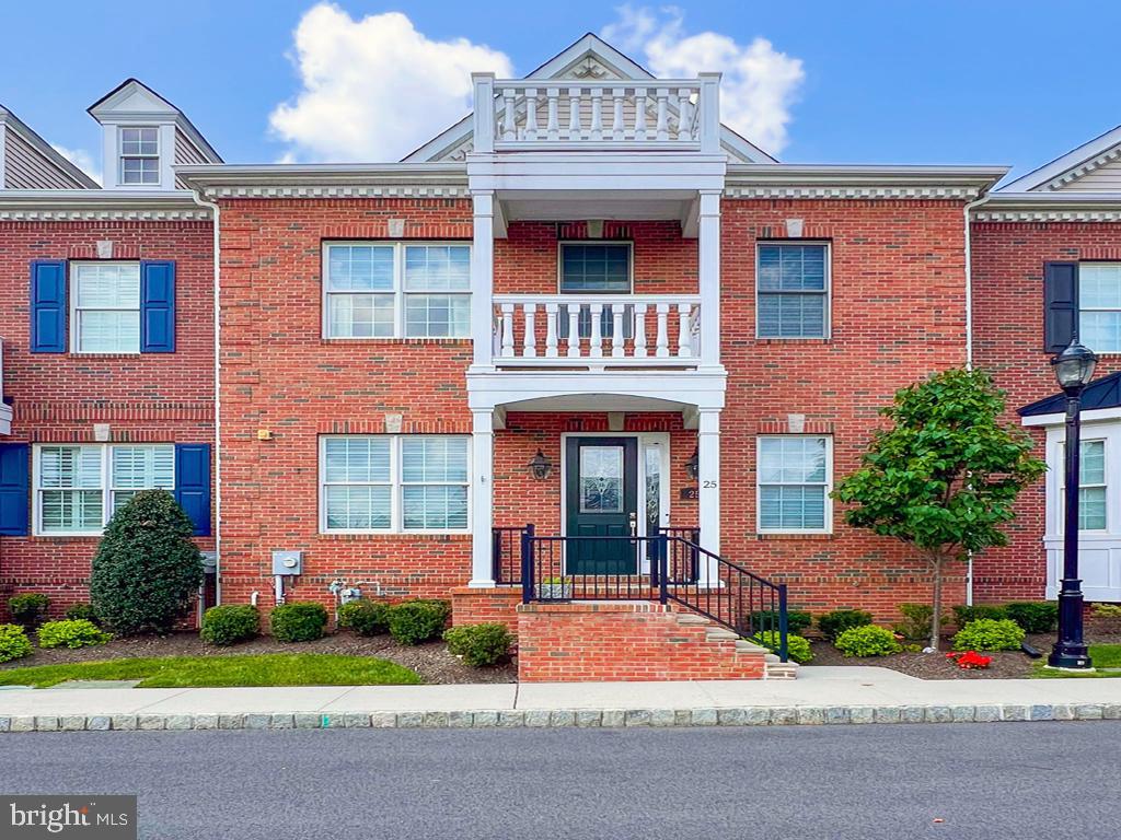 Absolutely STUNNING luxury townhome located just steps from downtown Yardley in the much sought-after community of Yardley Walk. This formal model home has all the "bells and whistles" and is awaiting it's new owner. Overlooking the beautiful community grounds, the portico front entrance welcomes you and your guests. The large entry foyer features a large coat closet, a beautiful turned hardwood staircase, picture frame moldings and hardwood flooring. Adjacent to the foyer is the spacious dining room with tray ceiling, chair rail, extensive woodwork, recessed lighting and double chandeliers. The highlight of the main floor is the massive gourmet kitchen featuring designer built-in stainless steel appliances, quartz counter tops, center island, recessed lighting, walk-in pantry closet and a butler pantry complete with wine refrigerator; perfect for entertaining. The open-concept breakfast room and family room offer more custom moldings and a corner fireplace. Around the corner you will find the rear foyer with access to the private deck, a study nook with built-in cabinetry, the half bath, a walk-in utility/coat closet and the rear stairway leading up to the 5th bedroom/bonus room offering versatile use. The second level features the large main bedroom with a luxury bath and two custom walk-in closets. Two more nicely sized bedrooms, a hall bath with double vanity and the laundry room complete the second floor. The third floor is massive and can be a bedroom, office, gym or guest quarters complete with a sitting area and private bath. Hardwood floors, recessed lighting, ceiling fans and custom moldings throughout. Oversized rear-entry HEATED garage! Four zone heat and cooling. Expansive full basement with egress window waiting for your finishing touches. Luxurious, maintenance-free living in the heart of beautiful downtown Yardley. Walk to shops, restaurants, festivals, parks and more!