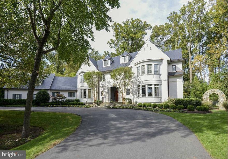 Extraordinary new price in Rapley!  Quality  craftsmanship w/ exquisite mill work, custom moldings,high ceilings designer finishes throughout.. Excellent floorplan w/ gourmet KIT, BF rm, Office, Lib, Sun Rm, Billiards Rm & more. 4 BR Suites up w/great MBR w/sit rm, marble bath & w/in closets. Addt' fin.4th lvl w/ 2BR suites. Fin. LL w/ REC rm, Exrcs & Studio. Patios, fountain,  & prof landscpe.