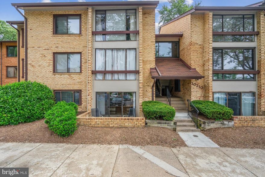 Large one bedroom/one bathroom condo, in convenient Oakton location, close to Vienna metro and Route 66.  Newly installed LVP flooring in living areas and freshly painted throughout.   Bask in sunsets from the west facing sunroom or outside on the brick knee-wall enclosed patio.  The patio is a perk only ground floor units enjoy.  Kitchen meets modern design trends with soft close white mission style cabinets, tile backsplash,  granite counters and tile floors. Microwave and dishwasher are new.  Laundry is right around the corner from kitchen with new full size, front load washer and dryer.  Enjoy daily meals in the breakfast nook, an extension of the kitchen.  Generously sized dining room is perfect for more formal ocassions.  Not an entertainer?  Use this space as a home office.  Find quiet comfort in the bedroom with new carpet , black out drapes and a walk-in closet that is sure to surprise.  Modern design in vanity, fixtures and even the exhaust fan in the bathroom meet the durability of the orignal tub.  Water heater is brand new.  Reasonable monthly condo fee includes water/sewer bill.  Pay only electric and internet/cable service.  Parking is open, making it unrestricted for number of vehicles.  Amenities in the neighborhood include tennis courts, outdoor pool and a dog park.  Exercise room available 24/7 with secure access obtained from condo association post-settlement.  Borge Street Park is about two block aways and has basketball courts, swings and other tot lot amusements.