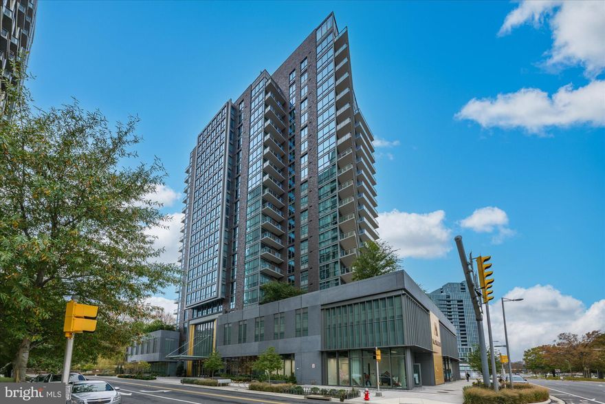 Three stories above the closest comparable unit, this exceptional residence offers unobstructed light, panoramic views, and a level of privacy rarely found in condominium living. Over $200,000 in elevated upgrades separate it from every other home in the building both in function and finish, it stands in a class of its own.

Designed for modern living, the layout features a uniquely flexible second bedroom with two integrated Murphy beds, dual desks, and tailored shelving transforming the space into a guest suite, office, or library with ease, eliminating the need for additional furniture. Custom millwork continues at the entry foyer with a built-in bench and coat storage, while the primary suite includes a bespoke dresser that seamlessly conveys.

Smart upgrades solar-powered blinds, concealed TV and lighting wiring, RH fixtures, and an illuminated media console create a harmonious blend of architecture, technology, and comfort. 

Life at The Monarch is defined by service and amenities: 24-hour concierge, resort-style outdoor pool, fitness center, resident lounges, landscaped courtyards with fire pits, meeting rooms, and curated spaces for hosting and everyday living. It is McLean’s only full-service luxury condominium, delivering a sophisticated and effortless residential experience.