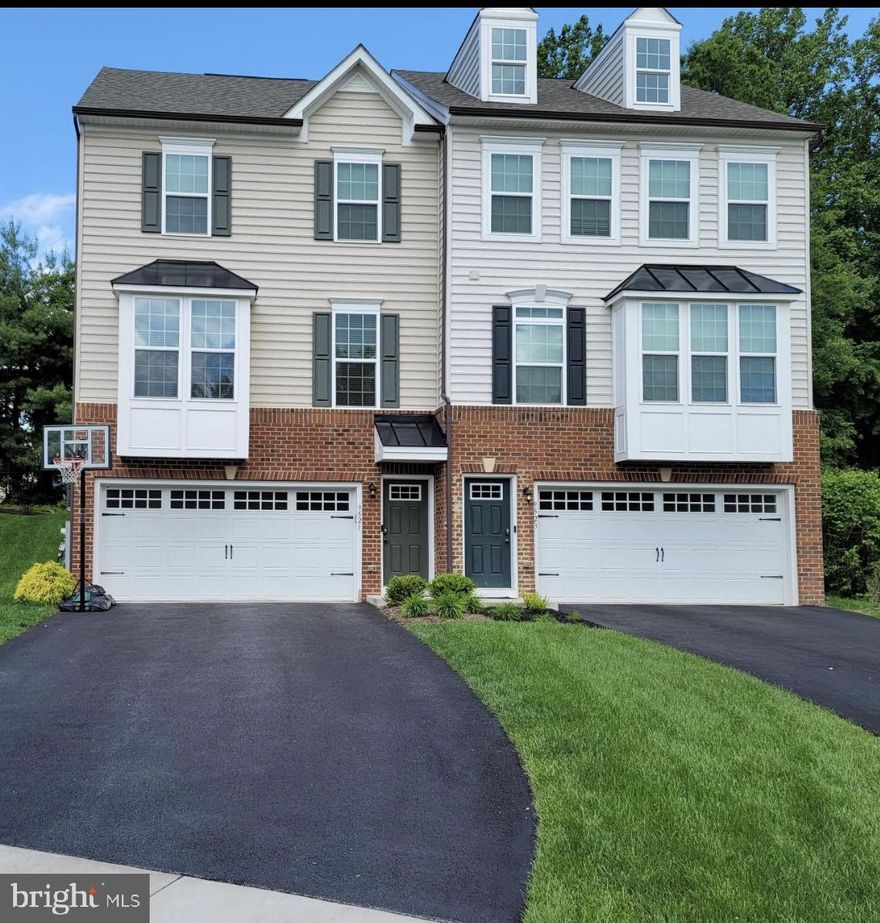 SHOWS LIKE A MODEL- End Unit 3 level townhome/duplex  W/ Bump Out.  Features a Gourmet eat in kitchen with butlers pantry, granite counter tops, stainless steel energy efficient appliances, gas stove, built in microwave, oversized center kitchen island, 42in custom soft close cabinets, Recessed Lighting, Hardwood plank floors throughout the main level, upgraded hardwood stairs w/ iron stair railings.  Gourmet kitchen, Trex deck /Premium  Lot.  Primary suite W/ Tray ceiling, recess lights, ceiling fan and walk-in closet.  Primary bath W/Garden Soaking Tub,  Separate shower w/ seat and separate water closet & ceramic floors.  Laundry room w/washer & dryer upstairs for you convenience. Full bath upstairs in hallway w/ granite counters & ceramic floors. Finished  Basement/rec room with recess lighting, full bath room with tub, ceramic flooring and granite counter top. 2 Car Garage,  Shed.   Dream Home Alert - Don't wait schedule your showing Today !