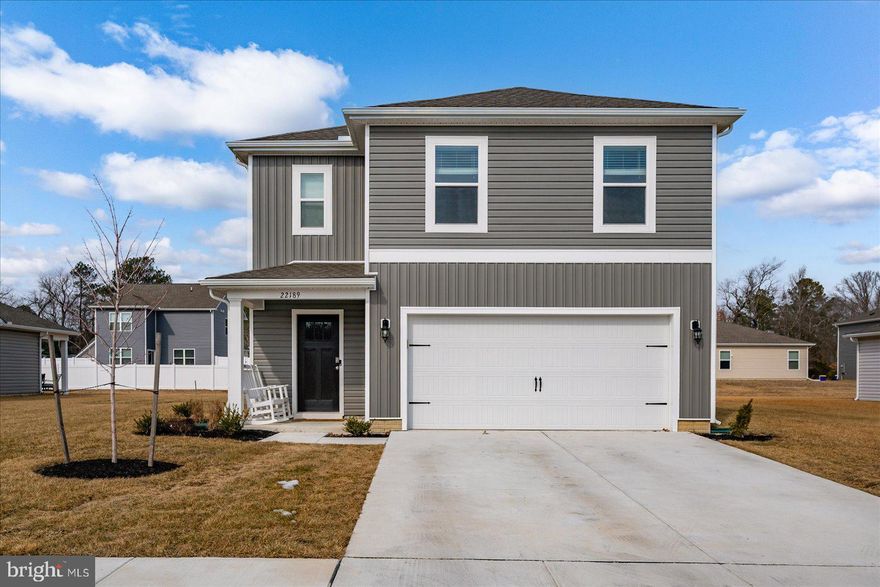 The Elm at Plover Point offers refined coastal living in this thoughtfully designed 5-bedroom, 3-bath two-story residence featuring approximately 2,415 square feet of living space and a two-car garage. The open-concept main level is ideal for both everyday living and entertaining, highlighted by a spacious great room that flows seamlessly into the dining area and kitchen.
The kitchen is elegantly appointed with granite countertops, stainless steel appliances, ample cabinetry, and a center island—creating a functional yet stylish gathering space. A first-floor bedroom and full bath provide flexibility for guests or multigenerational living, while the upper level offers a generous primary suite and additional well-proportioned bedrooms.
Situated within the desirable Plover Point community in Millsboro’s Oak Orchard area, residents enjoy access to a community swimming pool, pool house, playground, and picnic areas. Ideally located near the Indian River Bay, this home offers convenient access to boating, waterfront dining, and the area’s renowned Delaware and Maryland beaches. The Elm presents a compelling opportunity to enjoy modern coastal living with comfort, style, and convenience.