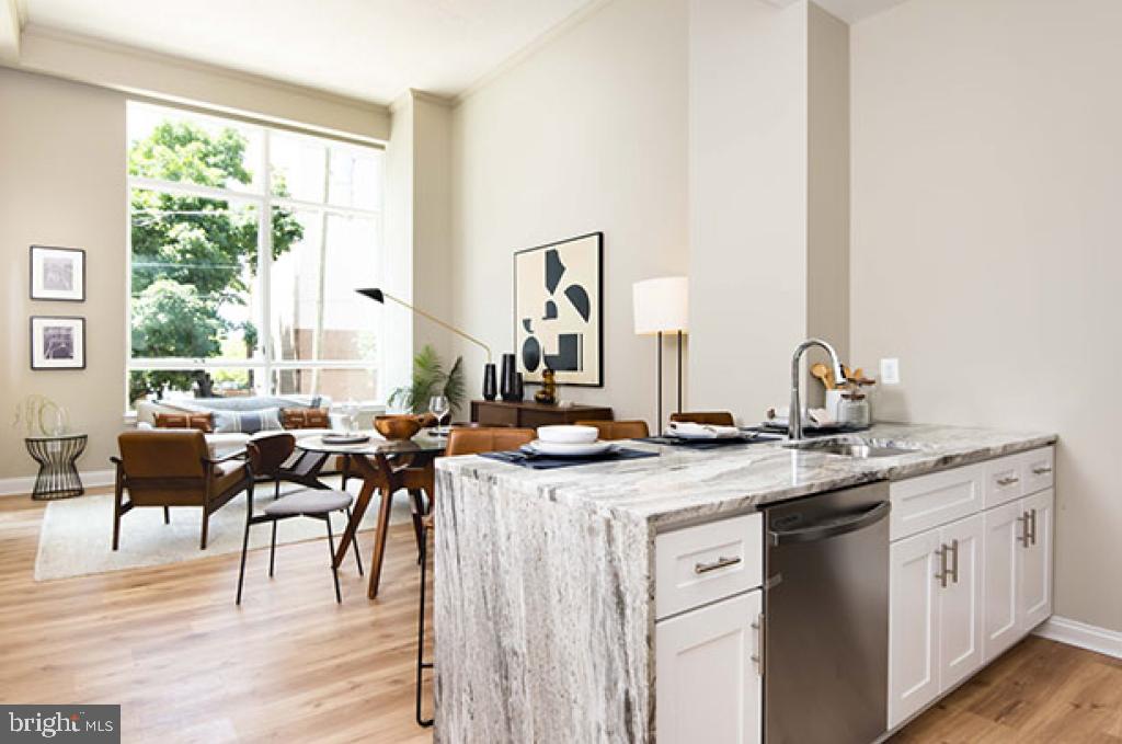 FOR A LIMITED TIME: Get one month of FREE RENT! Some restrictions apply. Introducing LOGAN SQUARE'S NEWEST LUXURY RENTAL BUILDING—The Apartments at 23rd & Cherry! This brand-new, 4-story rental community is nestled in one of Philadelphia's most sought-after neighborhoods, just one block from the Schuylkill River waterfront. This stunning one-bedroom apartment is the epitome of modern living, featuring a PRIVATE BALCONY (available in select units) that offers a peaceful retreat with breathtaking views. The spacious OPEN-CONCEPT living and dining area creates a perfect space for both relaxation and entertaining.
The kitchen is a chef’s dream, equipped with sleek GRANITE COUNTERTOPS, high-end STAINLESS STEEL appliances like a DISHWASHER, under-mounted sinks, and an enormous BREAKFAST BAR that’s perfect for casual dining or meal prep. The apartment also features HARDWOOD FLOORING throughout, abundant NATURAL LIGHT, and an IN-UNIT WASHER AND DRYER for added convenience. This studio residence is generously proportioned, offering plenty of space for comfort and relaxation, while the beautifully designed tiled bathroom adds a touch of elegance and luxury to the residence. This apartment truly stands out as a perfect 10 in terms of design, functionality, and style!
When it comes to amenities, The Apartments at 23rd & Cherry takes luxury to the next level. The building offers a STATE-OF-THE-ART FITNESS CENTER, complete with PELOTON® Cycles for your workout needs. You can also unwind in the resident lobby LOUNGE or enjoy the fully-furnished ROOFTOP DECK with PANORAMIC VIEWS of the city. The exclusive rooftop "Bark Park" offers a DEDICATED SPACE FOR YOUR FURRY FRIENDS to play and relax, and the building also provides RESIDENT BICYCLE STORAGE with tools and a pump. For added convenience, UNDERGROUND PARKING is available for residents, and an online resident portal simplifies rent payments and work order submissions. PET-FRIENDLY policies make this the perfect home for you and your pets.
Located in the heart of Logan Square, you’ll have instant access to the Schuylkill River Trail for outdoor activities and scenic views. Arts and culture abound nearby at the Academy of Natural Sciences, Bartram's Garden, The Franklin Institute, The Rodin Museum, and The Barnes Foundation. For shopping enthusiasts, Philadelphia’s Rittenhouse Square and world-renowned shopping destinations like Target, Sephora, Nordstrom Rack, Boyd’s, Apple, and The Shops at Liberty Place are just minutes away. Dining options are plentiful, with top spots like Vernick Fish, Jean Georges, Walnut Street Cafe, Moustaki, Friday Saturday Sunday, Dizengoff, and Shake Shack right around the corner. You can also visit the Philadelphia Zoo, catch a concert at World Cafe Live, or enjoy a game at the historic Palestra. The area is also CLOSE TO MAJOR EMPLOYERS such as the Comcast Center, Cira Centre, Aramark, the Hospital of the University of Pennsylvania, and Children’s Hospital of Philadelphia (CHOP). TOP UNIVERSITIES including the University of Pennsylvania, Drexel, and USciences are also nearby. With easy access to 95, 76, 676, 30th Street Station, Suburban Station, and more, COMMUTING IS A BREEZE. Living at The Apartments at 23rd & Cherry means enjoying the best of both Center City and University City right at your doorstep. Come home to your dream apartment today! The photos showcase the model unit.