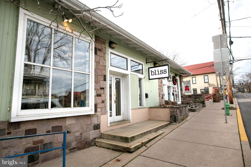 Prime downtown New Hope retail location, join several long term businesses on W Bridge St and enjoy an off-street parking space and private, one car garage for storage.  Soaring 10.5' ceiling, this bright space is 23' wide and 25' deep, clear span with display windows overlooking the heavy foot and vehicle traffic.