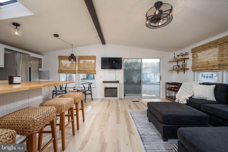 Welcome to Assateague Pointe!
This completely renovated 2 bed 1 bath unit comes FULLY furnished with all brand new furniture/items and has been designed and finished out! Upgrades and contents include: luxury vinyl plank flooring ran through entire unit, 4 door stainless steel refrigerator, 5 burner stainless gas range with griddle, pro style stainless hood, butcher block counter top, subway tile backsplash, black stainless sink with professional style faucet, all new ceiling fans/lighting throughout, custom bamboo blinds throughout, tinted front slider for privacy,  new AC unit, brand new 42” flat screen mounted in living room, electric fireplace, bathroom vanity with quartz countertop, Kohler toilet with push button flush, BRAND NEW sectional, Queen bed with new mattress in primary bedroom, full bed with new mattress in spare,  ALL décor/shelving/cabinet contents/rugs etc. included. New gazebo with retractable roof, patio furniture, brand new gas fire pit and grill.  Outdoor solar powered shower with 11 gallons of hot water, shed with new white refrigerator inside for overflow, custom privacy railing installed around fence, solar lighting installed around fencing system.