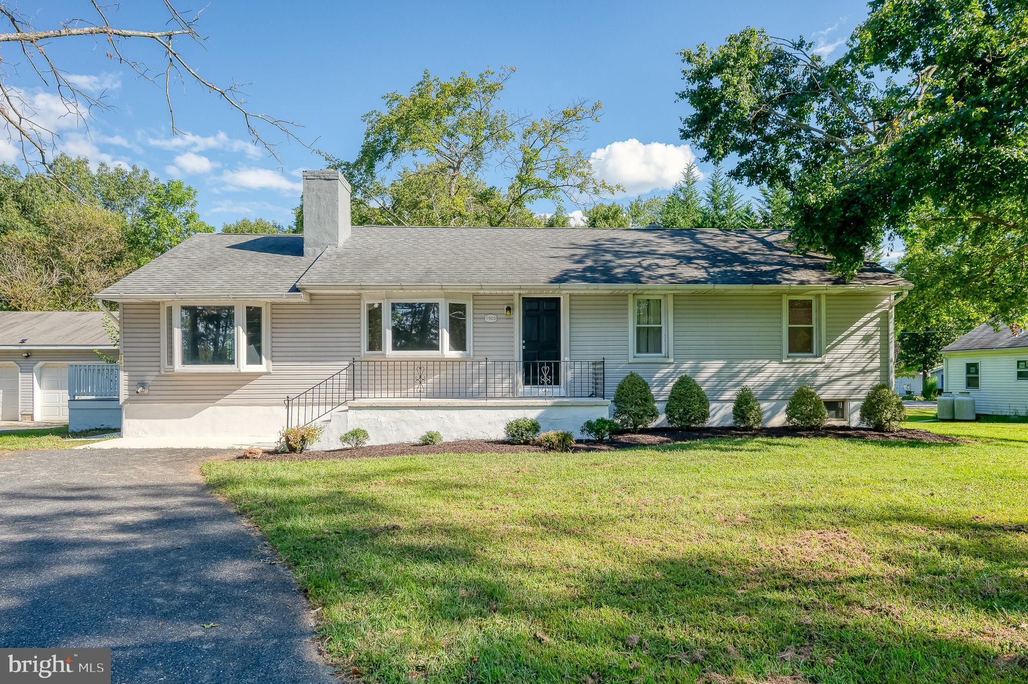 Charming rancher set on a spacious 2/3-acre lot with no HOA! This home offers a two-car detached garage, bonus storage shed, and a paved circular driveway with plenty of parking. Recent updates include a new septic system installed in 2022. Inside, you’ll find a bright living room with a bay window, hardwood floors, recessed lighting, and a cozy fireplace. The eat-in kitchen has granite counters, white cabinetry and stainless steel appliances. The primary suite features an attached full bath and exit to a private deck, while three additional bedrooms with hardwood floors and ceiling fans share a full hall bath. The lower level provides laundry and ample storage. It has a waterproofing system and has the potential for future finishing.