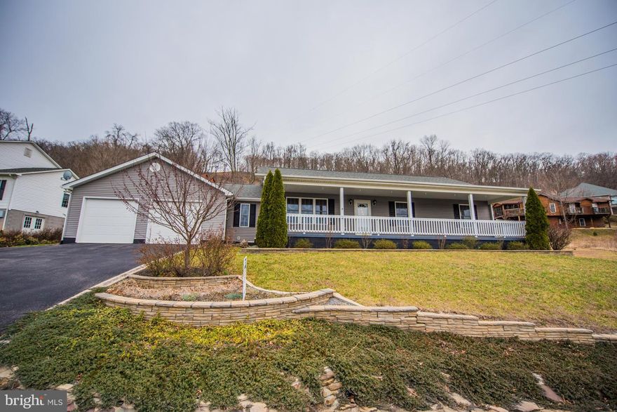 One Level Living!  Living Room, Kitchen & Dining room feature an open floor plan w/ cathedral ceilings.   Laundry/mud room off 2 car garage + work out room (not incl. in sf).  Spacious front porch, patio in rear, landscaping for privacy, paved drive, & stone terrace for small garden. Out of town but just min to shopping, restaurants, medical, & spas. Tons of storage in garage & 4' crawl space.