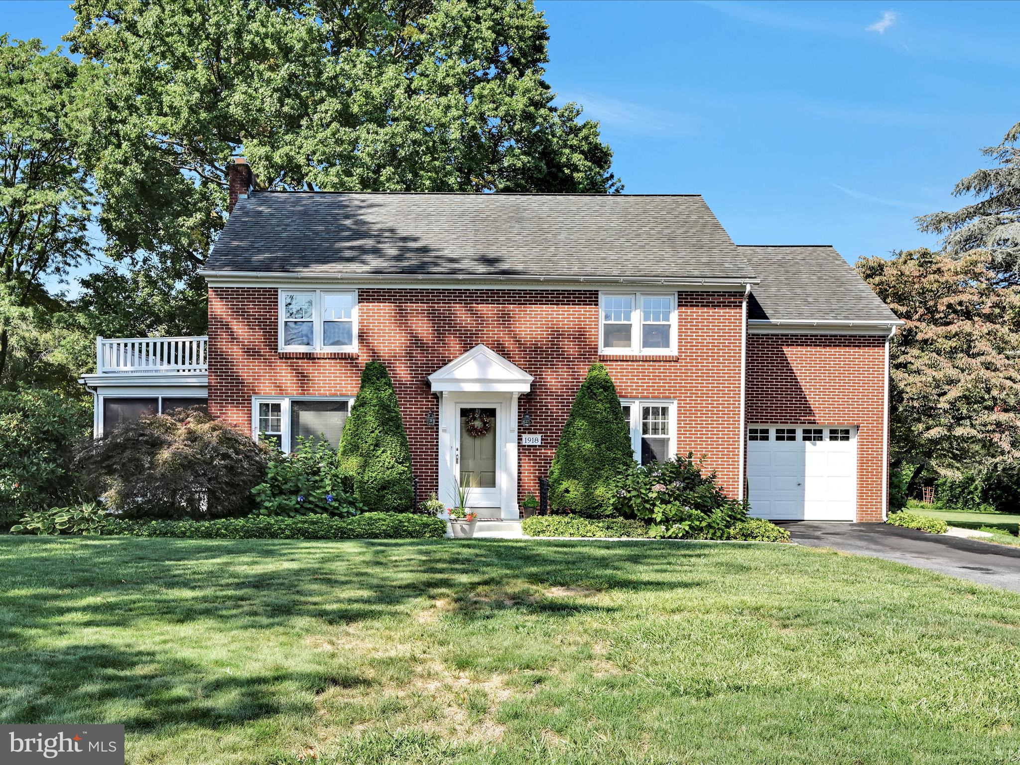 This well-maintained and thoughtfully updated mid-century brick home combines timeless character with modern convenience. Sunlight fills the rooms through plentiful windows, showcasing the beautiful hardwood floors. The renovated kitchen is both stylish and functional, designed to meet today’s needs.
The welcoming living room features a brick fireplace, creating a warm and comfortable centerpiece. With 4 bedrooms, there’s room for family, guests, or a home office. Step outside to a private screened porch—an ideal retreat for relaxing and entertaining—overlooking the large, level backyard framed by mature trees and landscaping.
Situated in a peaceful neighborhood, yet just minutes from major roads, shopping, and schools, this home offers the perfect balance of serenity and accessibility. Economical gas heat and ongoing updates by the current owner make this property move-in ready and easy to maintain.