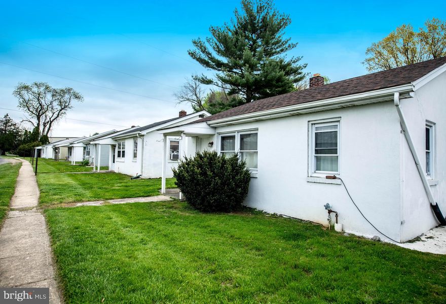 Income producing property, zoned R2. Property consists of 2,500 square foot shop building with fenced storage and two apartments, 6 individual cottages and a mobile home. Present rental income $11,000 per month when fully occupied. Property is presently 100% leased.