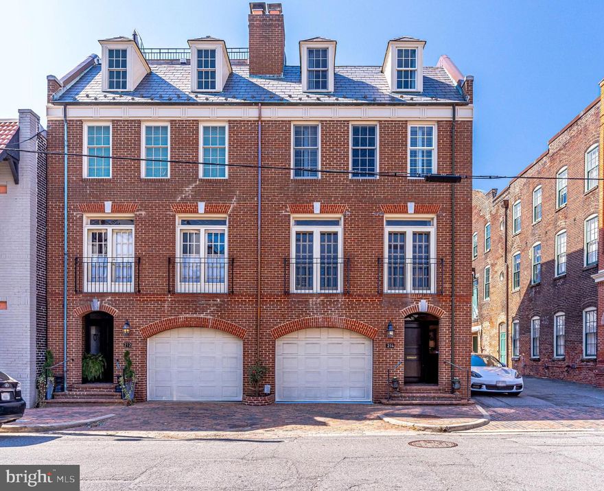 This stylish 4 bedroom, 4.5 bathroom, end-unit townhome is only one block to the Potomac River and King Street! Walk to boutiques and restaurants while you park your car in the garage or the two additional deeded parking spaces. The 3306 square foot light and bright townhome has been meticulously cared for with no detail overlooked. Features include gleaming hardwood floors throughout, three wood burning fireplaces, Bose Surround Sound, custom built-ins, handsome moldings and spacious rooms inside and out for entertaining. The first floor family room walks out to the large private fenced brick patio and garden with outdoor lighting and convenient irrigation system.  The gourmet kitchen features Jenn Air stainless steel appliances, Jerusalem limestone countertops, custom oiled bronze pendant lighting, breakfast bar, table space, pantry and French doors that lead to a balcony where you can enjoy your morning coffee or grill in the evening. The spa-like bathrooms have special features including heated floors, steam shower, soaking tub, rainwater shower head and customizable mood lighting.  There is even a peek of the Potomac River from the living room and upstairs bedroom!  NOTE:  surface parking can accommodate 3 small sedans,  the deeded parking is 7 feet wide and 44 feet long.  Easy commute to DC, Amazon HQ2, Reagan National Airport and other major commuter routes.