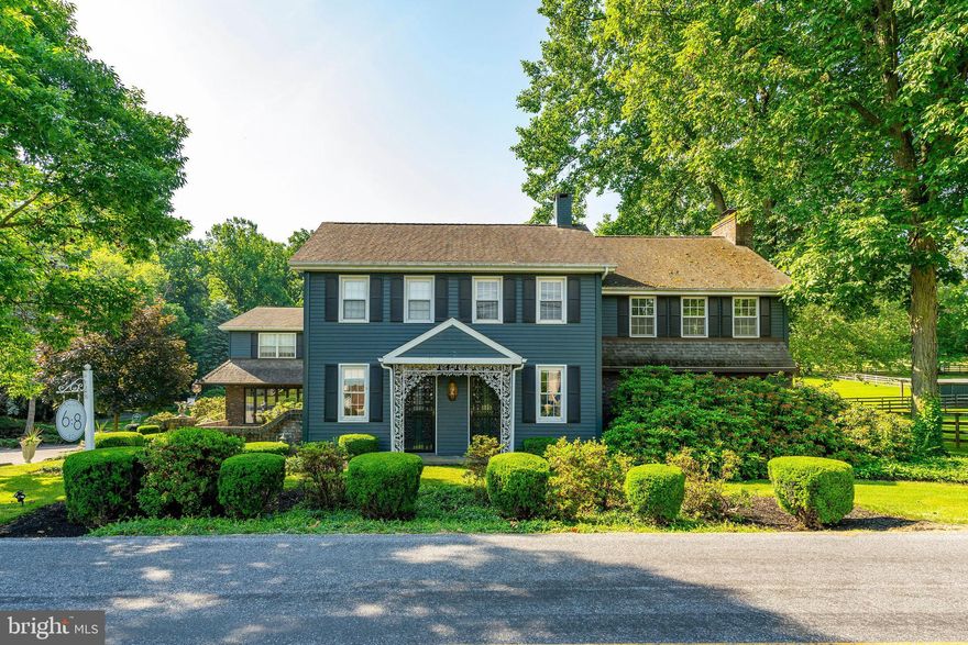 Welcome to this fully renovated 1880’s home, set on nearly 10 acres of beautifully landscaped, park-like setting in the Eastern York School District. This unique property blends timeless 1880s charm with modern upgrades with income potential. You will be greeted by lush green lawns, fenced horse pastures with run-in sheds, a peaceful stream, and a scenic fishpond complete with a charming gazebo. 47x35 detached horse barn with four large stalls, a full bath, separate office, and tack room. The original 37x21 two-story barn includes a feed room, garden room, hay loft, workshop, and a one-car garage. A detached two-story building serves as a fully operational modern hair salon with four stations (one leased for $715/month), while the second floor offers a spacious two-bedroom apartment with a full kitchen, living room, and bath, rented to a long-term tenant for $1,300/month.
Inside the main home, a beautifully updated kitchen boasts radiant Italian ceramic tile flooring, a large center island with granite countertops, stainless steel appliances, and a stylish coffered ceiling. The formal dining room, also with radiant tile flooring, features arched doorways and large windows offering picturesque views of the pond. The expansive two-story family room is the heart of the home, complete with a floor-to-ceiling brick gas fireplace and abundant natural light. The first-floor primary bedroom offers a peaceful retreat with double doors, a coffered ceiling, dressing area, and access to a half bath. Upstairs, a bright open sitting area leads to two rear balconies overlooking the grounds. The second primary bedroom includes crown molding, a coffered ceiling, dressing area, and cozy sitting nook, while an additional bedroom and full bath complete the level. Outdoor living with a large deck, patio, and balconies—perfect for entertaining or simply enjoying the natural beauty.
Whether you're looking for a private retreat, a home business, or agricultural opportunities this one-of-a-kind property delivers. Convenient access to shopping, restaurants, and amenities, and unmatched character and versatility, this estate is truly a rare gem. Zoned for a variety of uses—including home businesses, agricultural endeavors, and farm stands—it’s as functional as it is beautiful. Schedule your private tour today and experience all the exceptional features this estate has to offer!