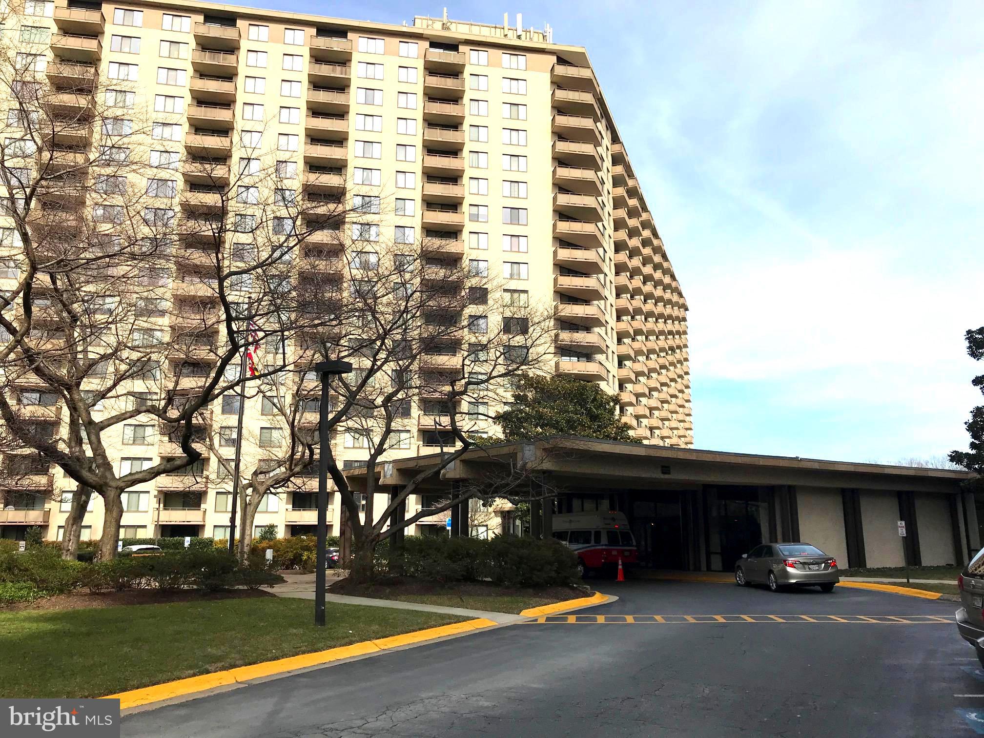 Beautiful, rarely available corner unit with extra windows , and a large balcony with gorgeous views. 25% Beautiful corner unit, larger than standard units with extra windows. Breathtaking view from large balcony. Large eat in kitchen with lovely maple cabinets. Oversize den/office. Updated bathroom with granite counter top. Gleaming hardwood flooring through out. High security building with 24 hour guard gate and front desk Concierge. The building has it's own Beauty Parlor, Grocery store/Deli, gourmet Italian Restaurant, Travel Agency, Dry Cleaners, and more. Activities abound, like tennis, pickle ball, swimming/hot tub, ping pong, movie night, trivia night, open mic nite, exercise classes, New Years eve party, book club, canasta, bridge, mahjong and much more. Secure indoor parking, electric car charging station, car washing station, and plenty of guest parking. Beautiful grounds for walking. Near Metro , I-495 Beltway, busses, shopping and restaurants. Co-op fee includes property tax, all utilities and maintenance. No dogs allowed.