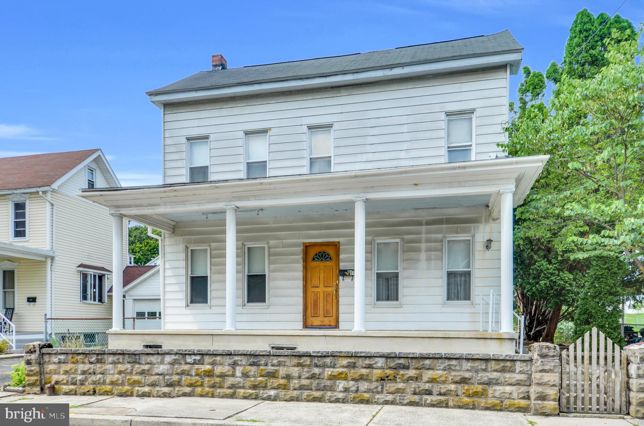 Discover the space and charm you've been looking for in this 3-bedroom, 2-bath Colonial, nestled in the heart of Cressona Borough and the Blue Mountain School District. From hardwood floors to inviting porches, this home offers comfort and flexibility inside and out. Most of the interior features hardwood flooring, complemented by spacious living areas, a large covered front porch, and side porches on both levels that add unique character. The deep backyard provides ample room for outdoor enjoyment, gardening, or expansion. A detached workshop—formerly a one-car garage—offers great space for hobbies, storage, or could be converted back. Additional highlights include a heated attic, hot water radiator heat, public water/sewer, and low taxes. Offered as-is, this property presents a great opportunity to build equity with some updates and personal touches.
