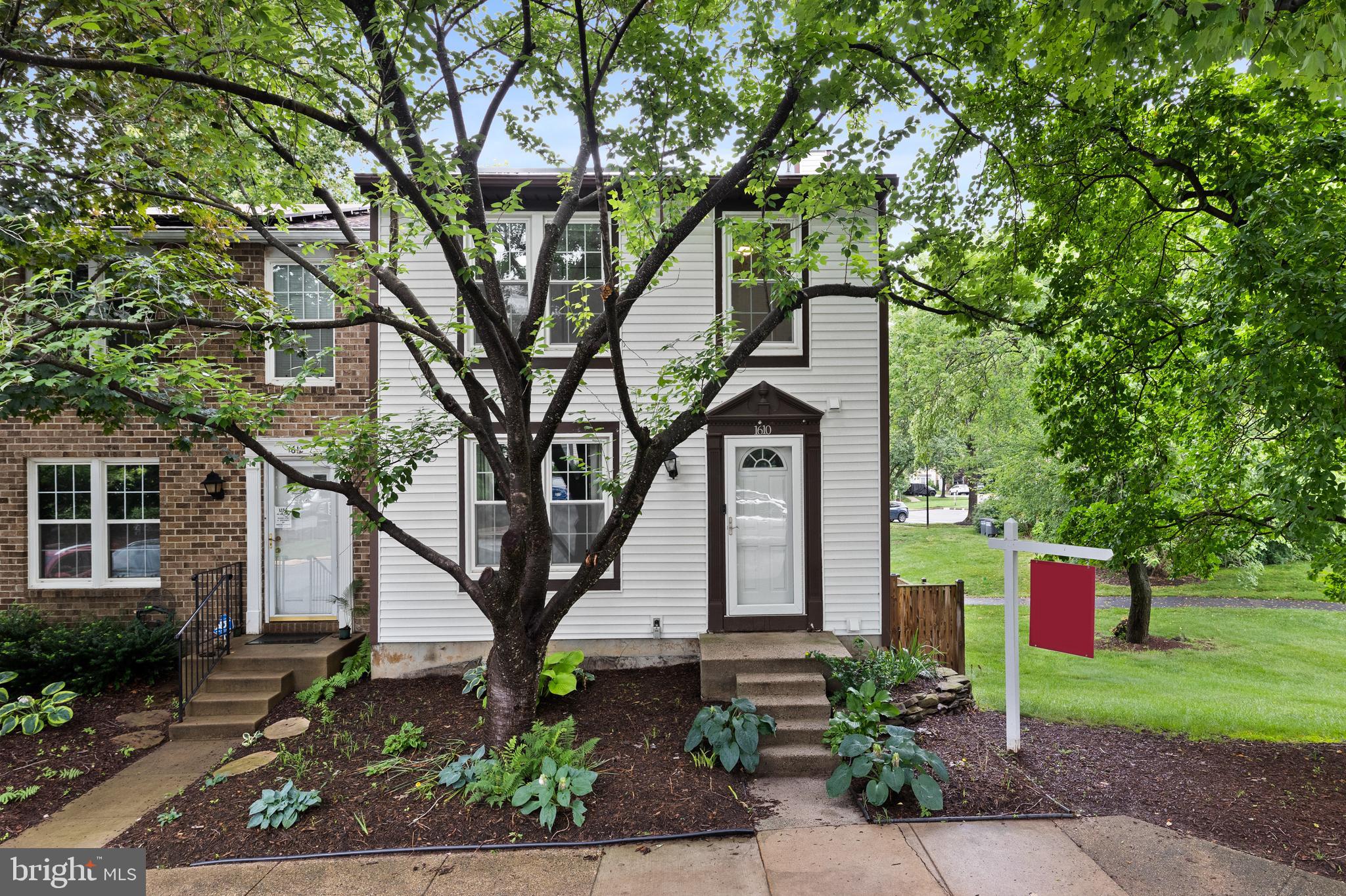 Welcome to this beautifully renovated and upgraded three level end unit townhome backing to green space in North Reston. *** Super low electricity bill due to the solar panel array on the roof (fully paid off and owned). *** The main level features brand new LVP floors, a living room, dining room, kitchen with breakfast/dining area and powder room. *** The upstairs level features LVP throughout, the Primary Suite with walk-in closet and Elfa shelving system plus two additional bedrooms and second full bathroom. *** The walk-out lower level features tile flooring, a rec room with fireplace, half bathroom, storage areas and door leading out to the oversized fully fenced backyard with patio. *** Two assigned parking spaces directly in front of the home and ample visitor parking throughout the cluster. *** A partial list of updates and renovations includes new siding and hot water heater (2022); kitchen appliances (2020); patio and fence (2019); windows and exterior doors (2018); solar panels and tile flooring (2017); Architectural shingle roof and LVP flooring (2016). *** Enjoy all of Reston's abundant amenities including 55 miles of paved and unpaved walking/jogging/biking trails, 15 pools, 4 lakes, multiple picnic areas, multiple recreation areas, 52 tennis courts (26 lit for night play), multiple basketball courts and soccer fields, two community centers, resident programs for all ages, and much more.