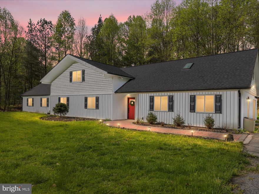 BACK ON MARKET DUE TO SELLERS BEING RELOCATED! Nestled on nearly 7.5 secluded acres and backing directly to the serene Liberty Reservoir, this extraordinary property offers the perfect fusion of refined living and natural beauty. Whether you’re seeking a family haven or a high-performing short-term rental (with over $110K in 2024 bookings on Airbnb and VRBO—financials available upon request), this home is truly one of a kind.  Step inside to discover a stunning open-concept layout, where expansive living and dining areas flow effortlessly around a show-stopping gourmet kitchen. Thoughtfully designed for entertaining, the kitchen features an oversized island, designer backsplash, double wall ovens, and sleek, modern finishes—an entertainer’s dream.  The main level includes three generously sized bedrooms, highlighted by a luxurious primary suite with sliding glass doors, peaceful views, and a spa-inspired ensuite boasting dual shower heads and corner seating. A fully walk-in, handicap-accessible hallway bath and a stylish half bath provide convenience and comfort for guests and family alike. 
Upstairs, a spacious loft awaits—complete with a wet bar and open sightlines to the kitchen below. Perfect for game nights, movie marathons, or relaxed evenings with friends. This level also features two additional bedrooms and a full bath, offering ideal space for larger families or visiting guests. Just off the kitchen, your private INDOOR oasis awaits. Dive into the heated, climate-controlled indoor pool—equipped with brand-new maintenance equipment, its own half bath, and seamless access to the outdoor patio. Whether it’s a cozy winter swim or a vibrant summer soirée, this space is designed for year-round enjoyment.  Located in Carroll County, ranked the #6 best school district in Maryland, with a driveway that easily accommodates over 10 vehicles. Bonus upgrades include a new well pump (2024).
All furniture is negotiable. Don’t miss your chance to own this truly unique sanctuary—where luxury, comfort, and nature come together in perfect harmony.