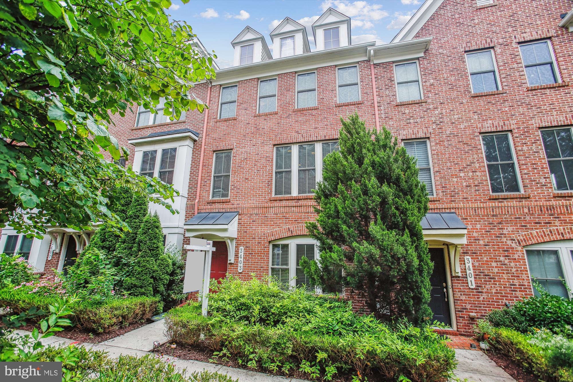 OPEN Thurs 4-6 and Sat 1-3 pm! Welcome to Shirlington Crest and 3403 Kemper Rd — a spacious, beautifully maintained three-level townhome offering over 2,000 square feet of modern living in an unbeatable Arlington location. Built in 2010, this home features four bedrooms, three and a half baths, and an attached two-car garage with extra storage space. Set back from the main road, the front door is in a quiet courtyard, while Shirlington restaurants, shops, and entertainment, are less than a half mile away!
This home has been gently lived in and meticulously maintained by its original owner. It features tall ceilings, hardwood floors throughout the home, builder upgrades, and an open floor plan. Climate control is efficiently managed by Nest thermostats, providing smart temperature management and energy savings. The entry level begins with a welcoming spacious foyer and continues with a private bedroom–perfect for guests, a home office, or a workout space–an additional full bath so that the entire level can be used as a guest suite if desired, and access to the garage.
The main level is designed for both everyday living and entertaining with a bright, open kitchen with island featuring a full suite of KitchenAid appliances, gas cooking, granite countertops, a tile backsplash, plus an oversized (we mean huge!) walk-in pantry with custom shelving. The living room features a cozy gas fireplace, beautiful built-ins, and recessed lighting, creating a warm and inviting space. Upstairs, you'll find three generously sized bedrooms, two full baths, and a conveniently located washer and dryer. The primary suite features two closets (one a walk-in!), both with custom shelving, and an ensuite featuring dual vanities and a large tiled shower.
Enjoy outdoor living on the private rooftop terrace — perfect for morning coffee, evening gatherings, or simply relaxing with a view. Prime location just a short distance to Shirlington Village, home to restaurants, shops, grocery, and more. Quick access to the W&OD Trail, Jennie Dean Park, dog parks, and major commuter routes including I-395. Just minutes from Old Town Alexandria, Pentagon City, Del Ray and beyond — offering an abundance of shopping, dining, and entertainment options right at your fingertips!