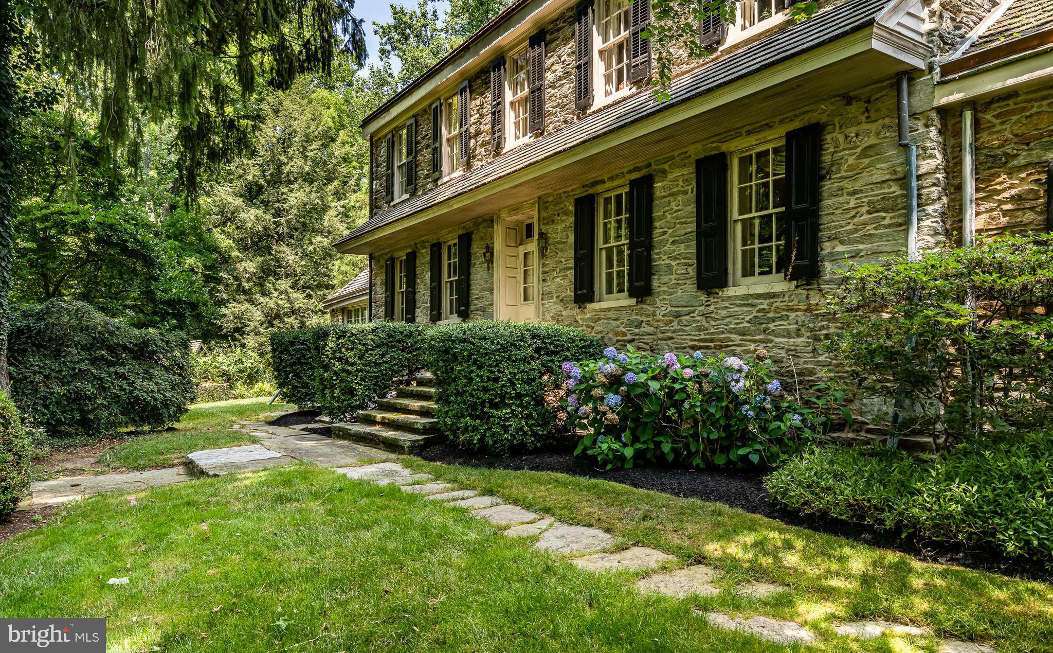 Classic Chester County farmhouse on 11.56acres with a 4 stall bank barn, stream, pool and pool house. This 1710 stone home is full of history and charm. There are 7 fireplaces in the main house as well as wide plank floors, exposed beams and stone walls. Downstairs has a kitchen with radiant stone floors, a walk-in pantry and a sunny breakfast area. Off the kitchen area is the family room with built-ins, vaulted ceilings and a stone fireplace as the centerpiece. the formal dining room is ample enough to host plenty of guests for your gatherings and has a wet bar. Across the hallway/foyer area is the formal living room with fireplace and a hidden back staircase to the second floor. There's a wonderful office with wet bar and lots of windows off the living area. This can easily be used as a 5th bedroom if desired. Upstairs there's a primary with ensuite bath plus two more bedrooms and a hall bath. There's a 3rd staircase off the kitchen that leads to another bedroom with an ensuite bath on the second floor. It's private and detached from the rest of the second floor. The walkup attic offers tons of storage, but could easily be converted to more living space or bedrooms. The pool house makes a great guest cottage. It has his and her bathrooms, a living area and another area overlooking the pool that makes a great bar area. Turn one of the baths into a kitchen and you have a full guest cottage - or expand if desired. The pool is where it's at in the summertime. The setting is stunning and surrounded by an oversized flagstone patio. Bring your horses to the 4 stall bank barn with two huge lofts, a garage, and more. The stream that runs through the property is accented by stone walls and bridges. There's also a 2 story spring house and secret grotto to explore. This country setting is surprisingly convenient to both Downingtown and West Chester Boroughs - each of which offer amazing dining, shopping and entertainment. Like to bike, hike, run or paddle? This home is located right across the street from the East Branch Brandywine Trail offering tons of trails and singletrack and easy access to the Struble Trail and Marsh Creek, Bring your creative uses to this amazing property.