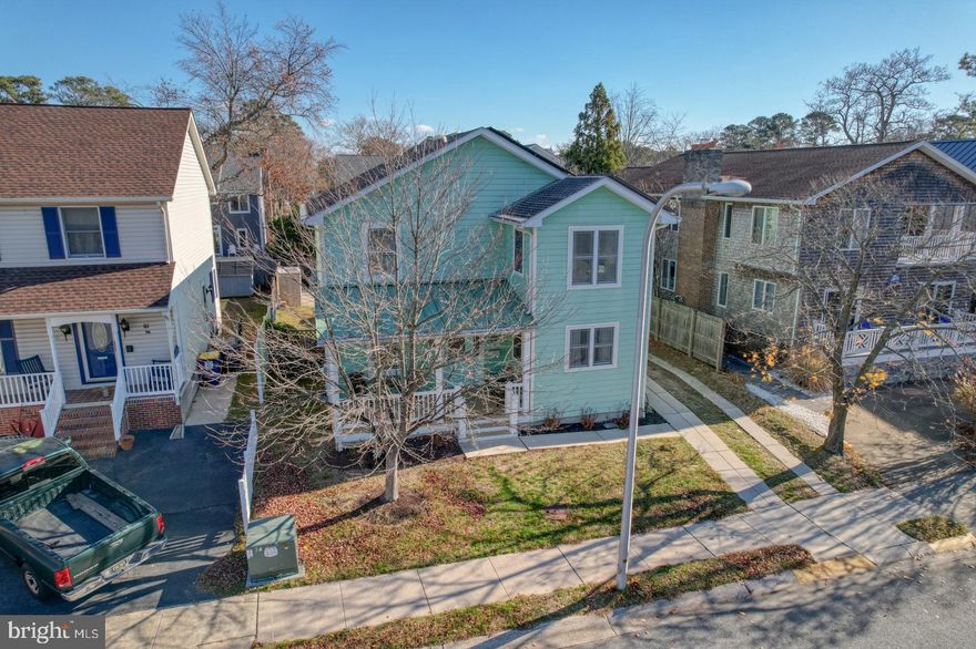 Just a few blocks to the beach!  Built on the site of the original Rehoboth Beach Country Club clubhouse, 109 Country Club Drive is located on a quiet street in the heart of Rehoboth Beach. This 6 bedroom, 5 bathroom home has been tastefully painted in a relaxing, coastal color palette and features plenty of space to rest and relax! As you enter through the front door, you’ll find a spacious living room, perfect for gathering together or relaxing on the couch. Next to the living room is a kitchen with upgraded solid cherry cabinets, double wall ovens, with lots of storage and counter space. The kitchen extends to a large open dining area with space for a 10-person dining table. Hardwood floors run throughout the first floor and you’ll love all of the natural light that pours in through the many large windows! One bedroom and an ensuite bathroom complete the first floor. Multiple spacious bedrooms and full bathrooms can be found on the home’s second floor. On the basement level, there is a washer and dryer, additional living space, another bedroom, and full bath. Featuring central air conditioning and solar panels, this home is cool and energy-efficient! If you’re impressed with the inside of the home, wait until you explore outside! The covered front porch provides a welcoming space to relax or you could head out back for a dip in the inground pool! You’ll love cooking dinner or entertaining friends on the large hardscaped paver patio next to the pool. A shed gives you the right amount of storage space for all of your pool and beach toys. An 8-foot tall wooden fence and lots of mature landscaping are the final touches on this private outdoor oasis! Off-street parking or free on-street parking gives you plenty of space for family and friends. With a strong rental history, this home would make the perfect investment property, full-time residence, or fun coastal getaway! Just a few blocks from the popular Silver Lake Tot Lot, Funland, and the world-famous Rehoboth Beach Boardwalk, this home offers everything you need to live a laid-back coastal lifestyle. This home won’t last long. Schedule your private showing today! Home is being sold AS-IS.