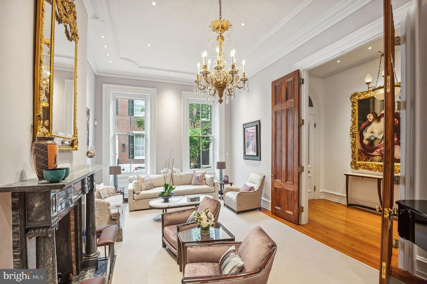 Situated on one of the most beautiful tree lined streets in Rittenhouse Square, 2017 Delancey is an elegant Federal Townhouse with two terraces and a GARAGE There is an additional PARKING space. The facade is beautiful with handsome entry doors leading to the 
27 ft. living room with 12 ft. high ceilings, magnificent French doors, gorgeous architectural details including crown molding. There are wide plank pine floors, a formal dining room (25 ft.) with a Pennsylvania Blue stone fireplace, (8 fireplaces in all) a light filled gourmet eat in kitchen with a skylight, three large windows and glass French doors which open to the first floor dining terrace. 
The wonderful primary suite with a Pennsylvania Blue fireplace is conveniently located on the second floor. The luxurious primary bath has two sinks, a soaking tub and a steam shower, generous closets. Adjacent to the primary suite is a large library/den with a fireplace, and bay windows leading to the second outdoor space, a lovely tranquil terrace. Two bedrooms each on the third and fourth floors. Finished lower level for gym/playroom, additional storage. A short walk to Rittenhouse Square, the wonderful neighborhood shopping and the fabulous innovative restaurants including Vernick, Parc, D’Angelos, Barclay Prime. Not to mention: The Bakeshop, Spread, Metropolitan & La Colombe. Please see the video and floor plan icons