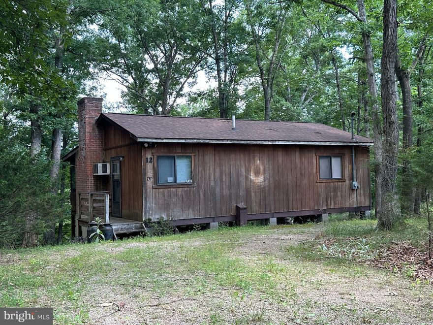 KEEP IT SIMPLE....CUTE LITTLE CABIN ON 2 WOODED ACRES ELEVATED AT 1750 FT OFFERING GREAT WINTER VIEWS AND WITH A LITTLE CHAINSAW WORK YOU'D HAVE KILLER YEAR ROUND VIEWS! JUST THE BASICS INSIDE, 2 BEDS, A BATH, SIZEABLE LIVING ROOM AND VERY NICE SCREENED PORCH. IN PRETTY DECENT SHAPE FOR IT'S AGE, NEW ROOF IN 2021.....NO BIGGER THAN IT IS, IT WOULDN'T TAKE A BIG BUDGET TO GUSSY THIS PLACE UP REAL NICE....IF YOU'RE HANDY AND WILLING TO WORK, THIS PLACE COULD BE WHIPPED INTO SHAPE FOR PENNIES! THE MAIN ATTRACTION IS THE LOCATION.....SMACK DAB IN THE HEART OF THE LOST RIVER VALLEY, THE PERFECT HUB FOR ALL THINGS OUTDOORS.....ONLY 1 MILE FROM RT 259, GENERAL STORE, PIZZA PLACE & GYM....4 MILES FROM LOST RIVER STATE PARK, LESS THAN 10 MILES FROM SEVERAL ACCESS POINTS TO THE GEORGE WASHINGTON NATIONAL FOREST, ROCK CLIFF LAKE, TROUT POND, KIMSEY RUN LAKE, MULTIPLE TROUT FISHING DESTINATIONS.......UNLIMITED HUNTING, FISHING & HIKING AT YOUR FINGERTIPS! THE PERFECT BASE CAMP FOR ALL YOUR OUTDOOR PURSUITS, BIG TIME AIRBNB $$$ ATM $$$$ POTENTIAL OR IF YOU'RE A MINIMALIST AND DON'T NEED MUCH SPACE FOR FULL TIME LIVING, IT'S A WINNER. CONVEYS TURNKEY, WHAT YOU SEE IS WHAT YOU GET WITH THE EXCEPTION OF A FEW ITEMS. THIS ONE CHECKS A LOT OF BOXES, MAKE THE CALL TODAY! THIS PLACE IS GONNA DISAPPEAR FASTER THAN POPSICLE IN JULY!