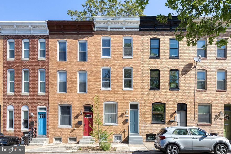 *Preferred lender can provide $5,250 grant to eligible buyer - reach out to listing agent for more information* Exceptional Properties. Exceptional Clients. Welcome to 422 E Lanvale Street – a beautifully maintained rowhome in the heart of Greenmount West, one of Baltimore’s most vibrant and artistic communities. This spacious home blends historic charm with thoughtful updates, including natural hardwood floors, fresh paint throughout, tall ceilings, and abundant natural light throughout. 
The main level features a comfortable living area, dining space, an updated kitchen with stylish countertops and ample cabinetry, a full bathroom, and a main-level bedroom with direct access to the private, fully fenced backyard—perfect for relaxing or entertaining.

The second level offers one spacious bedroom, a full bathroom, and a large additional living room area—ideal for a home office, media room, or lounge. The third level includes two nicely sized bedrooms and another full bathroom, offering flexibility for guests or creative use. The unfinished basement houses the laundry area and plenty of storage space. Recent updates include a newer water heater and updated outdoor air conditioning unit, offering peace of mind and energy efficiency.

Enjoy walkable access to Station North, Penn Station, Mount Vernon, and local galleries, cafes, and restaurants. Don’t miss your chance to own this light-filled and versatile home in the heart of Greenmount West!