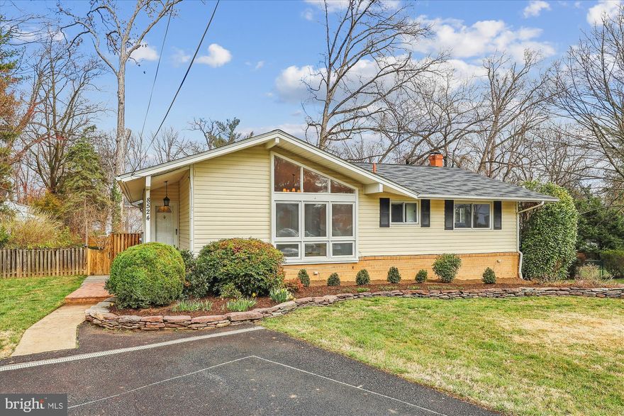 Welcome to this mid-century modern two level home located on a quiet cul-de-sac in Dunn Loring Woods. This home features hardwood floors throughout the main level and brand new carpeting in the basement.The foyer consist of a large coat closet/pantry, opening way to the vaulted ceiling family room with floor to ceiling windows to bring in plenty of natural lighting. There's also a separate dining area and a 350 SF all-season sunroom with windows/screens, ceiling fan and wall unit AC/heater that leads out onto a wooden deck. The main level features a primary bedroom with en-suite bathroom, and custom blackout shades. There are 2 other bedrooms with wooden blinds that share an updated hall bath with tub, linen closet, and all new light fixtures throughout. Each bedroom has a ceiling fan with light and custom closet organizers. The kitchen has granite counters, stainless steel appliances, gas cooking, and hardwood floors. The lower level has a great rec space, den, powder room, huge storage closet, utility closet, plus a large laundry room with stacked washer and dryer, utility sink, and bonus built-in shelving and extra refrigerator. The backyard is fully fenced with a large shed, mature landscaping, new landscape timber around the old play area with fresh mulch, perfect for gardening. The deck has stairs down to the yard with lattice and storage underneath. Enjoy a quick walk across the street to the newly renovated Cedar Lane Shopping Center: Simply Social Coffee, Toby's Ice Cream, Wings, Pizza, etc. Vienna is a great community filled with annual events like the Halloween Parade, Chillin on Church, ViVa Vienna, Oktoberfest, and tons of other classes and activities at the Community Center. The bus stop at Cedar/Bowling Green is a 6 min ride to the Dunn Loring Metro.