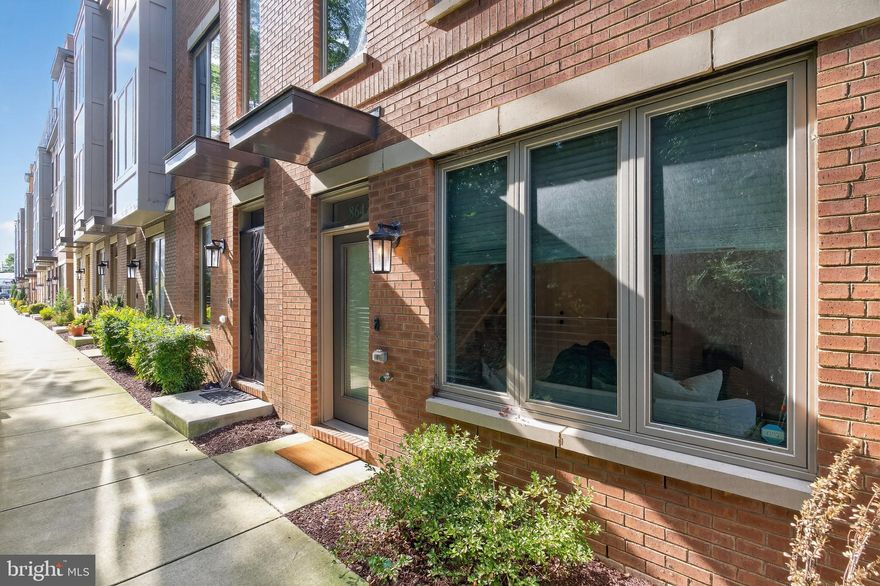 Rarely available end-unit! Built in 2021, this Granger model—the largest floor plan in Chapman Row—offers four finished levels of modern living. The entry level includes a one-car garage with EV charger + one driveway spot, and flexible office/rec space. The main level features an open layout with abundant light, large dining area, living room with balcony and decorative fireplace with mantle above, half bath, and a gourmet kitchen with gray quartz counters, stainless steel appliances, tiled backsplash, and center island with seating. Upstairs are two bedrooms with en-suite baths, including a primary suite with double vanity and glass shower. The top level boasts a loft with wet bar, mounted TV and soundbar, third bedroom, third full bath, and access to the private roof deck. Additional features include Schlage smart lock technology, garage door MyQ capabilities, plus entry level and outdoor lighting with Leviton app capabilities. The community also has a bosque area with outdoor seating––great for community gatherings. Ideally located just minutes from the Twinbrook Metro, nearby Pike & Rose, Strathmore, Pike Central Farm Market, Target, and the recently opened Wegmans. Please note: Square footage is estimated and calculated by an independent third party; information is deemed accurate but not guaranteed. Special financing options are available through Atlantic Union Bank. This property qualifies for 100% financing without PMI as a primary residence with qualifying credit scores. Reach out for further details