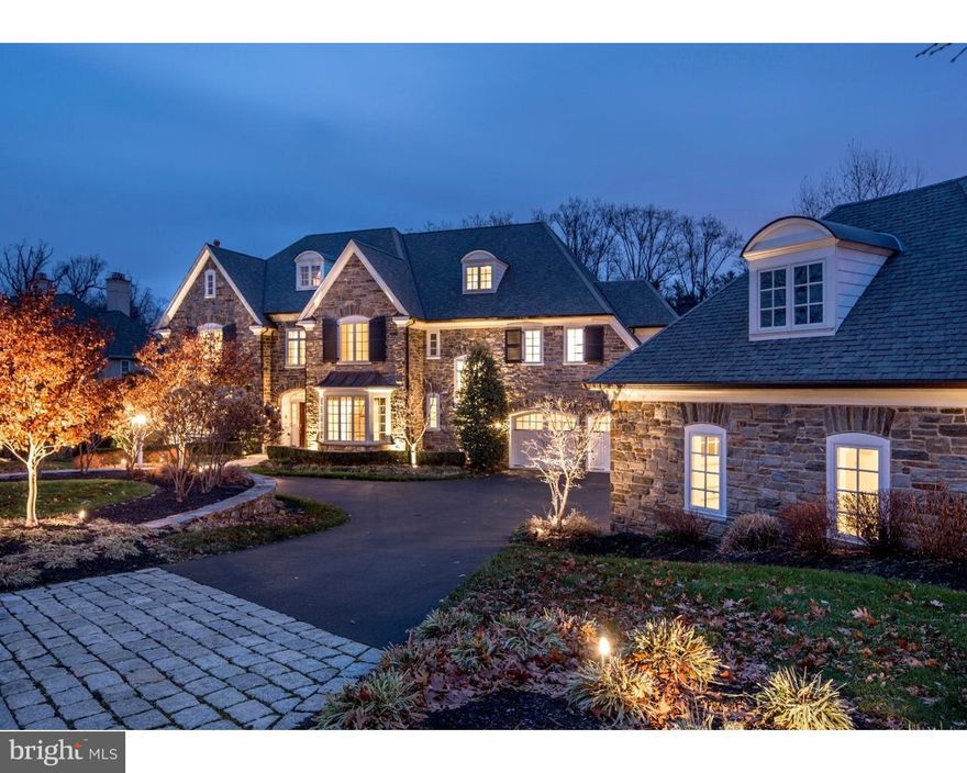 A stunning design by Drueding Builders, this regal stone manor home is nestled on a quiet cul-de-sac in the upscale Fenimore enclave of Gladwyne. Enjoy blissful residency in a friendly, safe & secluded community amid friendly families & accomplished professionals. Lush landscaping & a circular drive with a Belgian block apron set an elegant welcoming tone. Inside the 5 BR showplace, quality finishes abound & breathtaking views are showcased in many rooms. The fabulous enlarged floorplan begins with a front-to-rear domed ceiling reception hall. Glass-paneled rear doors open to the flagstone terrace with a built-in grill. Hardwood floors, recessed-paneled wainscoting, crown molding & 4 fireplaces beautify the main level. Host guests in the fireside living room & sophisticated dining room served by a butler's pantry with wine fridge. Through French doors, clad in custom cherry woodwork, is the charming library with a gas fireplace for after-dinner drinks. Chef & family will be drawn to the gourmet kitchen with a large dining counter for hanging out & top-grade Miele, Wolf & Sub-Zero appliances (including 2 refrigerator/freezers!) for the serious cook. A walk-in pantry, workstation desk & window-surrounded morning room to the terrace offers something for everyone. The kitchen spills into the gorgeous family room graced by vaulted painted beam ceilings, built-in cabinetry, gas fireplace & window wall overlooking private wooded rear grounds. A formal powder room & mudroom w/2nd powder room & family entrance optimize convenience. Front & rear stairs rise to the peaceful bedroom level. Hideaway in luxury in the light-filled master suite with vaulted beamed ceilings, a rear Palladian window, marble-encased gas fireplace & fitted his/her walk-in closet. Ecstasy awaits in the spa-style bath with a Whirlpool tub. Wide halls access 4 more Bedroom (2 en-suite), a shared hall bath, fitted linen closet & laundry room. The 2100 SF lower level is everything you'd want a family entertainment area to be with a pool table, coffered ceiling, built-in wet bar, counter seating, game & media areas, wine cellar, exercise room (or BR), full bath & bonus room. Park your vehicles in attached & detached garages accommodating 2 cars each. The location is convenient to the town of Gladwyne & major transportation routes. Note - some rooms have been virtually staged.