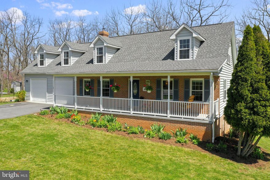 Perfectly Set On A Tree-Shaded Lot, This Kearneysville Cape Cod Feels Like Home The Minute You Pull Up. Walking Through The Doors You Are Met With Beautiful Hardwood Floors And Plenty Of Natural Sunlight.  The  Kitchen Is The Heart Of The Home, Complete With Large Customized Granite Island & Stainless Steel Appliances.  A Main Level Bedroom Offers You Or Your Guests A Relaxing Respite.  Warm The Home With The Wood Stove, Featuring A New Stainless Steel Liner And Rebuilt Chimney Crown In 2018.  Gardeners Delight As They Wander Through The Spacious Backyard Chocked Full Of Perennials; Blueberries, Blackberries, Raspberries, Asparagus, Artichokes, Nectarines, Figs, Strawberries, etc.  Your Plentiful 60x47 Organic Garden Is Protected By 8 Foot Deer Buster Fencing And Has Deep Soil Built From Composted Wood Chips.   Current Owners Harvested Over 200 Pounds In Winter Squash Alone. A new 16x8x9 Wood Shed,  With Black Walnut, Hickory And Ash From The Property, Was Added in 2018 to Conveniently Store Your Supplies. Outdoor Enthusiasts Will Appreciate The Private Lot, Leaving Plenty Of Space To Enjoy Your Hobbies, Including Nearby Hiking, Biking and Fishing.  A New Well Pump Was Added In 2020 Along With A Sub Drive Control Pressurized Well Tank.  Rest Assured Knowing A New Generator Sub-Panel Was Installed In The Basement In 2020.  Home Is Well-Situated On The Land And Provides Light Any Time Of Day; Wake Up To Sunrises And Wooded Views From The Owner's Bedroom And The Eat-In Kitchen; Watch Sunsets From The Covered Front Porch.  Stop By Today To Be Captivated By This Lovely Home.