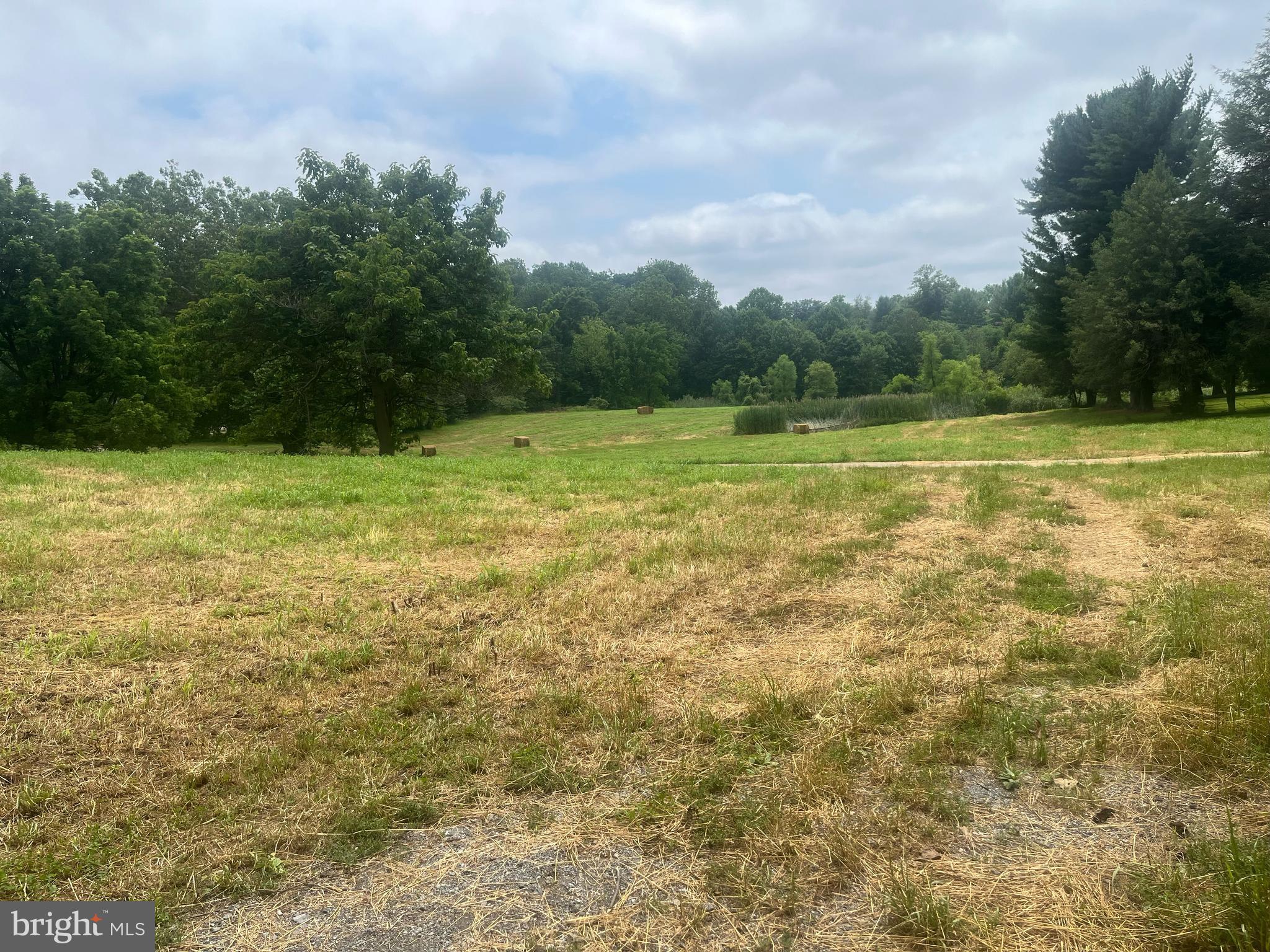 Rare 26-acre opportunity in desirable Kennett Township, directly adjacent to Kennett Square Borough and walkable to downtown. This picturesque property features a colonial home, a blend of open fields, mature woods, and a stream - offering natural beauty and development potential. Zoned Residential Medium to High Density (RMHD), zoning permits single-family homes, twins, or retirement communities by right. Townhouses (up to 6 dwelling units/acre) or multifamily dwellings (up to 12 dwelling units/acre) are permitted by conditional use. Ideal for developers, estate builders, or investors. Additional acreage is available - see listings for 109, 114, and 115 Chandler Mill Road. Located in award-winning Kennett Consolidated School District, minutes from Longwood Gardens and Route 1.
Buyer to verify all zoning and subdivision requirements with Kennett Township.