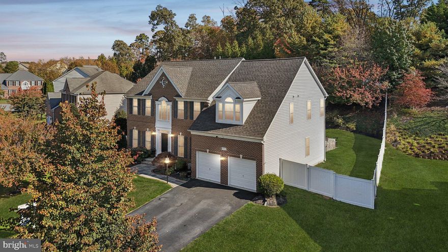 Welcome to this timeless brick colonial masterpiece in the sought-after Shipleys Retreat community, where architectural elegance meets luxurious modern living! Built by Winchester Homes, this stunning 5-bedroom, 5-bath residence offers an impressive 5,156 square feet of meticulously designed living space across three levels, including a finished walkout basement. The home’s exceptional condition and thoughtful upgrades create an atmosphere of refined sophistication throughout. The main level welcomes you with soaring two-story ceilings and gleaming hardwood floors that flow through the gracious formal living and dining spaces. At the heart of the home, the gourmet kitchen impresses with upgraded countertops, a six-burner cooktop, double ovens, a center island, and stainless steel appliances including a built-in refrigerator and ice maker. The adjoining eat-in area offers the perfect space for casual dining, while the kitchen opens seamlessly to the impressive family room, creating an ideal layout for both everyday living and entertaining. Additional main-level highlights include a formal dining room with crown molding and chair rail, a dedicated office, main-level laundry, and French doors that enhance the open flow between spaces. Upstairs, the luxurious primary suite serves as a serene retreat, complete with a spa-inspired bath featuring a new frameless shower and generous walk-in closets. Three additional well-appointed bedrooms and two full bathrooms—each updated with bidets—provide comfort and flexibility for family or guests. Throughout the home, nine-foot-plus ceilings, recessed lighting, ceiling fans, and custom millwork elevate the sense of space and style. The fully finished walkout basement expands your living area with approximately 1,600 square feet of versatile space, featuring a huge recreation room, wet bar, bonus bedroom, home gym, and media room—perfect for entertaining or relaxing. Outside, the professionally landscaped 0.34-acre lot offers extraordinary outdoor living with an expansive custom patio, built-in barbecue, extensive hardscaping, exterior lighting, and a new vinyl privacy fence providing both beauty and seclusion. An underground sprinkler system ensures the grounds remain lush and low-maintenance, while the new roof with architectural shingles adds peace of mind and curb appeal. Additional features include an attached two-car garage, multiple zones of forced-air gas heating, central air conditioning, and energy-efficient upgrades such as an air cleaner and humidifier for year-round comfort. Located in the desirable Shipleys Retreat community, residents enjoy access to common grounds, a scenic lake, and jogging paths. Conveniently positioned near shopping, dining, schools, and major commuter routes, this exceptional property offers the perfect blend of luxury, location, and lifestyle. With its impeccable condition, premium finishes, and thoughtful recent updates, 8011 Horicon Point Drive is a truly special home that’s move-in ready for its next chapter.