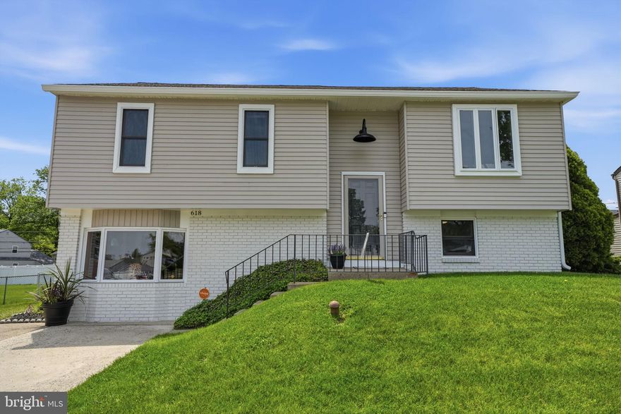 This adorable bi-level home perfectly blends functional living with your own private summer oasis. The exterior boasts a fresh, crisp look, complemented by a large concrete driveway that accommodates several vehicles, along with a sidewalk-lined street that connects you to many of life’s conveniences. Fresh exterior paint and front door warmly welcomes you inside. Step inside and marvel at the abundance of square footage ready to make your own. This spacious home features 4 bedrooms, 1.5 baths, and an impressive amount of living space that truly must be seen to be appreciated. The upper-level main living room flows seamlessly into the dining area and kitchen, creating an open and inviting atmosphere. This level also includes 3 bedrooms and a nicely updated full bath, with the primary bedroom offering its own private pocket door access to the bathroom. The lower level houses the 4th bedroom, currently used as an office, along with a large family room featuring a beautiful bow window and side door access to the driveway. An additional rear family room includes a convenient half bath and sliding doors leading to the covered patio. The backyard is truly inviting — featuring a covered patio, fully fenced yard, charming shed, and a beautifully finished concrete pool accented with elegant bluestone coping that enhances the freeform design. The location is ideal! Conveniently situated near shopping, restaurants, the YMCA, schools, and major commuting routes, this home is ready for its next owner to add their personal finishing touches. Come see it before it’s gone!