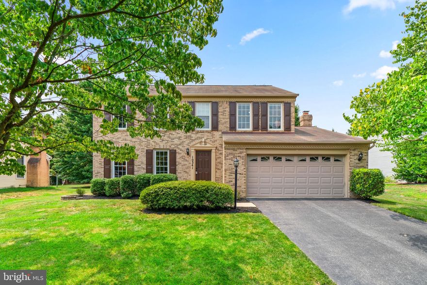 Stunning brick front colonial sited on a premium .32 acre homesite in the desirable Waverly Woods golf course community offering 3 levels with over 3,075 sqft, freshly painted interiors, and casual comfort combined with luxe amenities. This beautifully maintained home features a hardwood foyer, profile moldings and trim, a column framed formal living room with heightened windows with a seamless flow to a formal dining room joined to enhance your entertaining space. At the end of the hallway to your right you arrive at the inviting family room highlighted by a brick surround wood burning fireplace and a trio of windows providing an abundance of natural light and expansive views of the deck and yard, and just a step up to the kitchen. Awaiting your best culinary dishes is the cook's kitchen boasting recessed lighting, LVT flooring, classic white cabinetry, quartz counters, ebony appliances, a pantry, and an open breakfast room with a glass slider walkout to the deck with built-in bench seating. Retreat to the upper level owner’s suite presenting a vaulted ceiling with drop fan, a walk-in closet, and a private upgraded bath showing a dual sink vanity, a separate shower, and a corner soaking tub. Completing this home is the lower level highlighted by a rec room, a half bath, a games area, and a utility storage room for your prized treasures. Conveniently located just moments away from fine dining, shopping, recreation, tennis court, Waverly Woods Golf Club, commuter routes, and more!