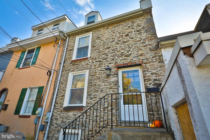 Welcome to 111 Pensdale Street, an elegant 3BR 2.5 Bath townhome just steps from lively Main Street in the NW Philadelphia riverside community of Manayunk. An oversized detached GARAGE and lovely private rear yard complete this serene urban oasis.  Highlights of this wonderful walkable location include easy access to the Canal Trail and Manayunk Bridge Trail which provides a vital link to other rail trails, Circuit trails and East Coast Greenway. The stately @1900 stone facade of this home welcomes you to enjoy an architecturally interesting interior renovated to provide a living room with balcony overlook into the spacious and modern kitchen. Kitchen level with attractive dining area and concrete floor. A radiant heat system was installed in the K and DR floor. Add the heater and it will be complete. Enjoy coffee, tea, or meal prep as sunlight streams through the French doors leading to your fully fenced rear yard. The rear yard view extends over a gravel path past ornamental grasses, evergreen arbor and beyond to the twinkling string lights of the PHS Beer Garden. An oversized detached stone garage at the back of the rear yard has high ceiling and alley access. Amenities in this lovely turn-of-the-century townhome include: Central Air, finished wood flooring, modern concrete flooring, 2.5 bright bathrooms. The main bedroom with skylight, ensuite bathroom and sitting area comprise the entire top floor. Laundry and utilities are located in a well lit basement room adjacent to the Kitchen. Updated utilities and recessed lighting complete the modern interior. This super location offers easy access to the commuter rail line, main highways & universities: Route 76, both Kelly and MLK Drives, Route 1 (City Line Ave), Route 476 (the Blue Route), PA turnpike, PCOM, Drexel Med, Philadelphia U, SJU, Wissahickon Trails, and cultural attractions, cafes, restaurants and shopping. Come and see this wonderful home listed on the Philadelphia Register of Historic Places today!