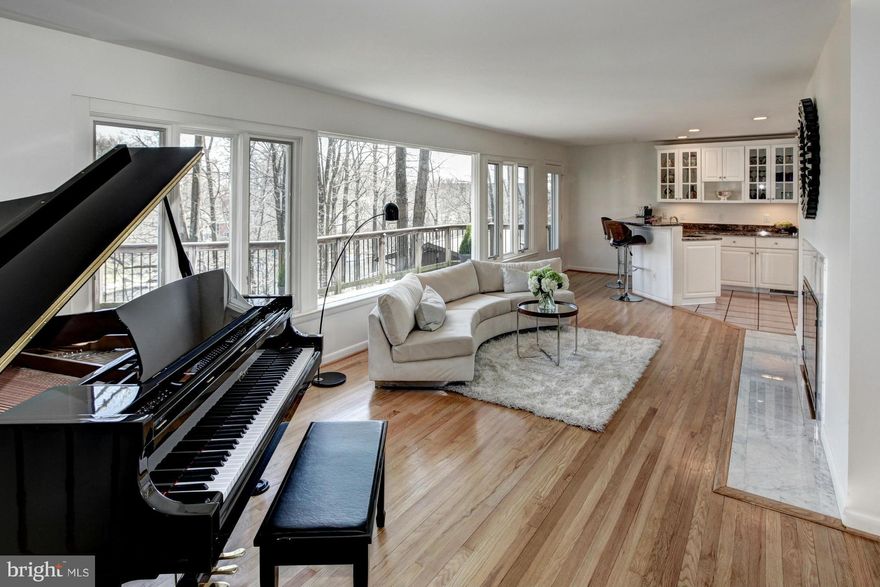 Amazing waterfront rancher at Lake Barcroft. Great areas for indoor & outdoor enjoyment. Renovated kitchen, baths, doors, windows. Downstairs wet bar & dining area. Private office w/potential use as 5th BR. 3 Fireplaces, hardwood floors, and custom finishes. Private dock for pontoon, great water views, patio, and deck with screened gazebo. AHS Home Warranty.