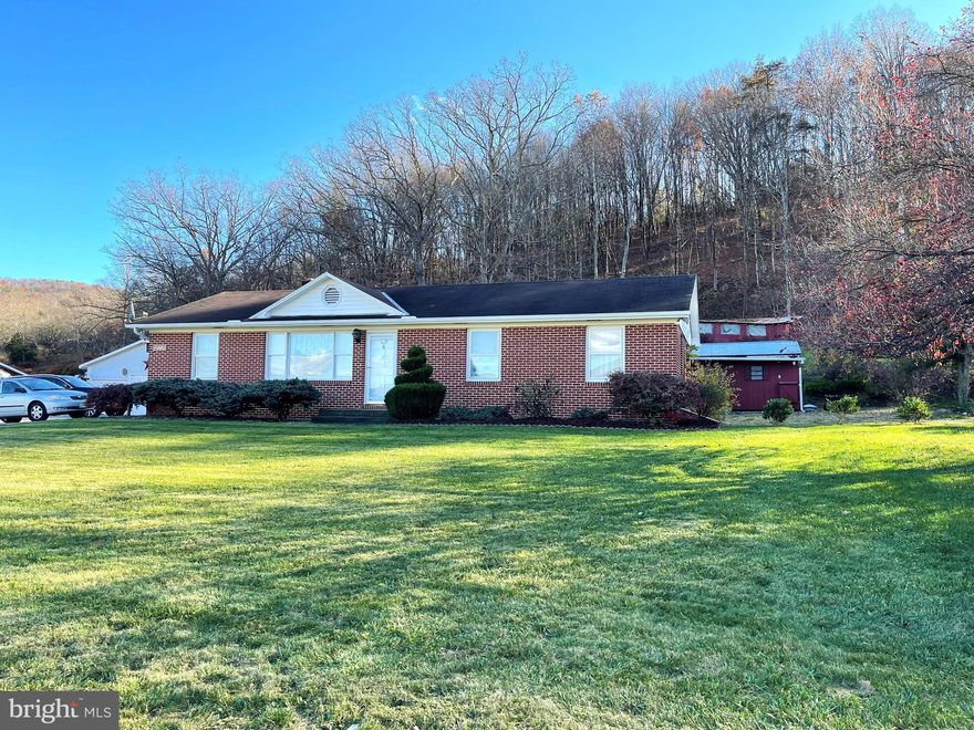 Immaculately maintained all-brick home on almost one-half acre lot,. Ideal one level living. New hardwood in Living Room and Hallway and new oven/range in kitchen.   (Roof is not new).  Convenient storage shed in back yard. Lovely Mountain and Valley views.