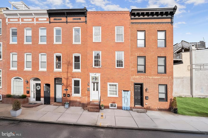 INVESTOR ALERT!  POTENTIAL RENTAL INCOME OF $6500 OR MORE PER MONTH! Discover this unique multi unit investment opportunity featuring three separate units with their own entrances in the sought-after Riverside neighborhood, just minutes from Federal Hill, Locust Point, and the best of Baltimore living. This multi-unit property is currently zoned for two apartments, with the potential for a third in the rear pending zoning approval or conversion into a garage. Hardwood and ceramic tile floors, exposed brick walls, and tall ceilings enhance the interiors. The first-level apartment features an open-concept living and dining area, while the kitchen is equipped with a gas range, refrigerator, and dishwasher. A hallway leads to the bedroom and a full bathroom with a tub-shower. A laundry closet with a stacked washer and dryer completes this unit. The second apartment spans the second and third levels, offering three bedrooms with a potential 4th bedroom and three full bathrooms. The main level includes an open-concept living and dining area, a kitchen with granite counters, and a full bathroom. A versatile bonus room with laundry could serve as an additional bedroom or flex space. Upstairs, the top level boasts a primary bedroom with a walk-in closet and an ensuite bathroom with a jetted tub-shower. Two additional bedrooms and a shared full bathroom complete this level. Accessible from the rear alley, the potential third apartment is a two-level space featuring an open-concept main level, with one bedroom and one full bathroom on the upper level. The property is currently zoned for two units, with two meters—one servicing the main-level one-bedroom apartment and the other for the three-bedroom unit. An excellent opportunity for investors seeking strong rental income potential with a flexible layout, prime location, and updated features.   Some images have been virtually staged.